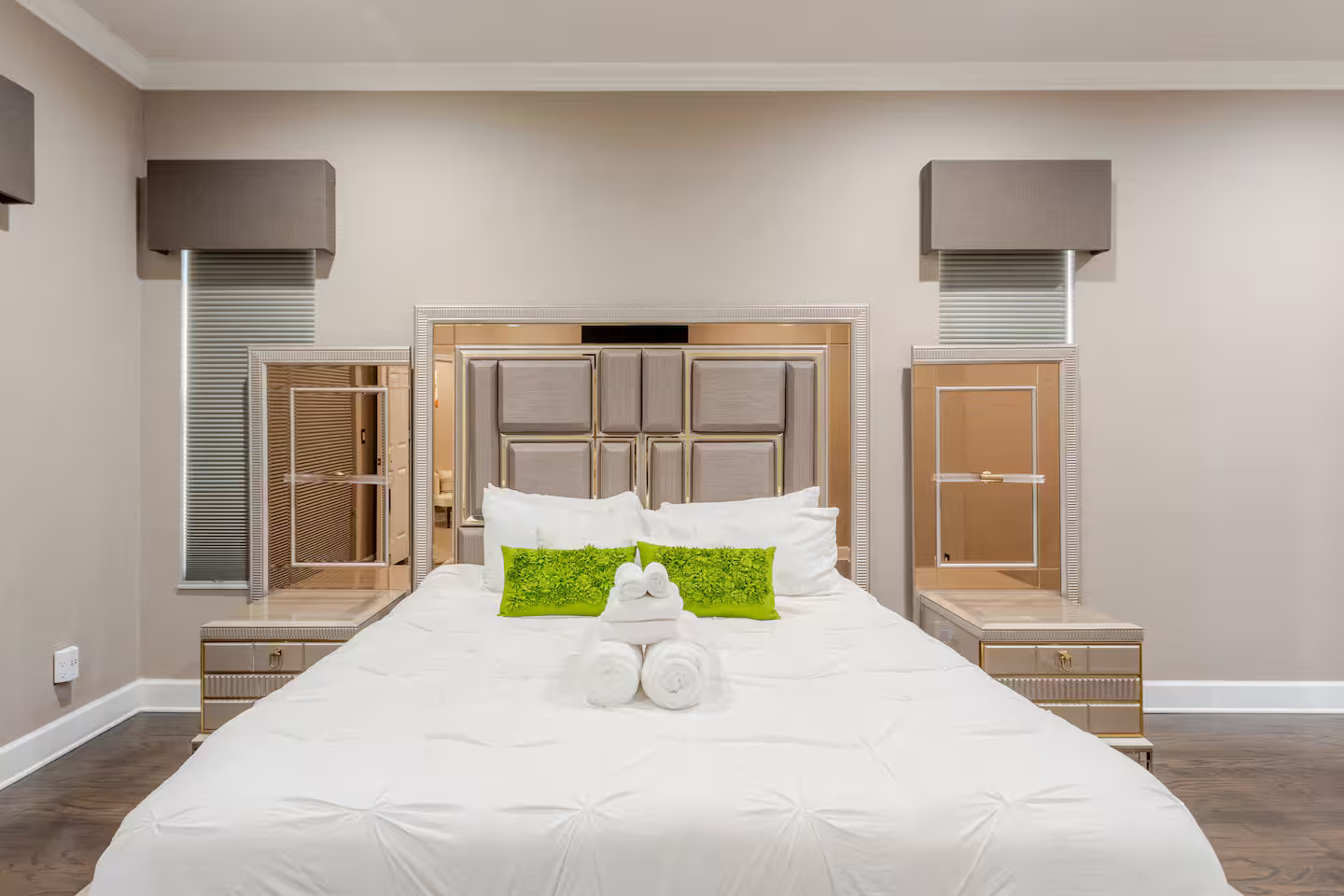 Serene master bedroom w/ soft light & ample space.