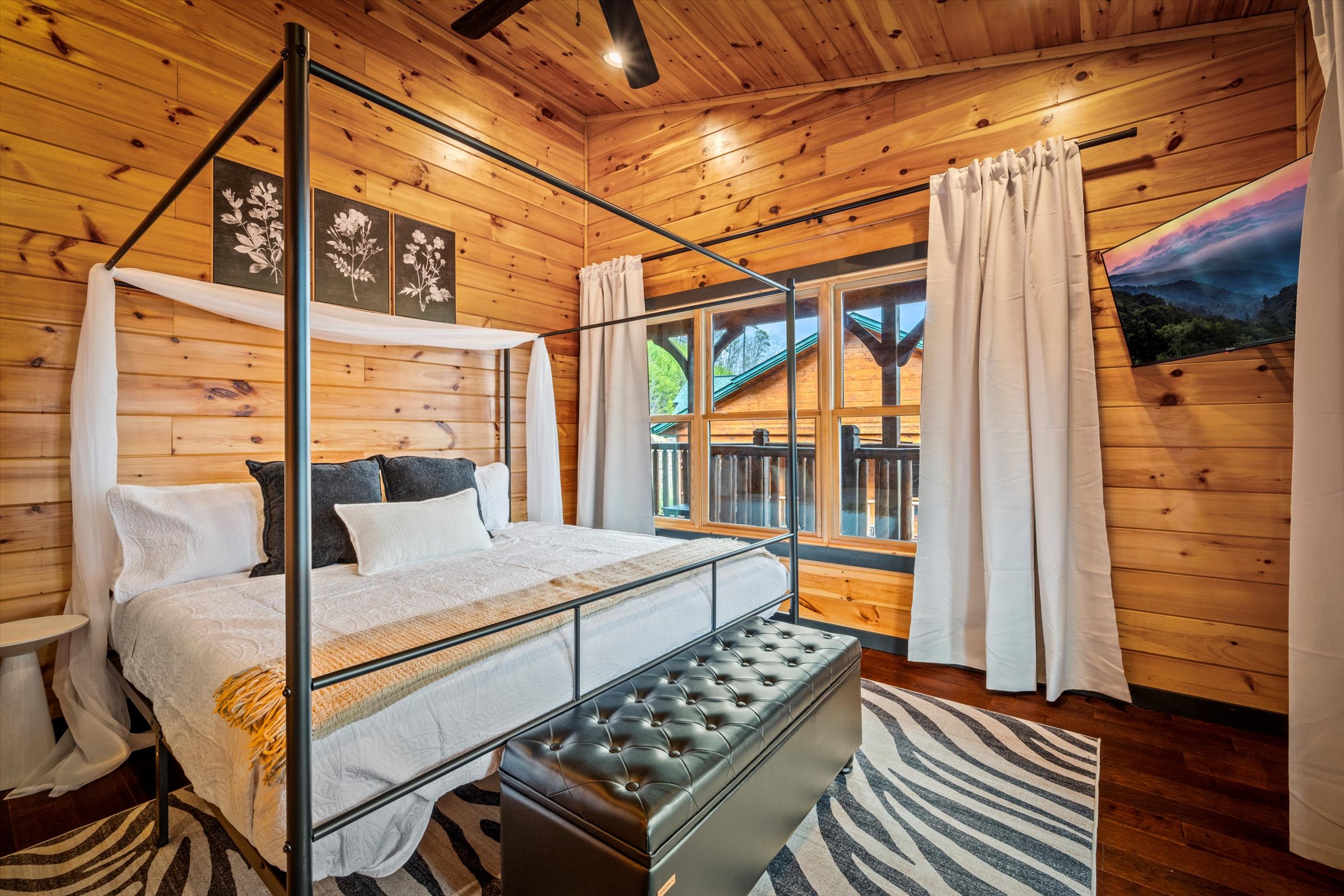 Bedroom 2 (upstairs) has a king canopy bed and a private bathroom.