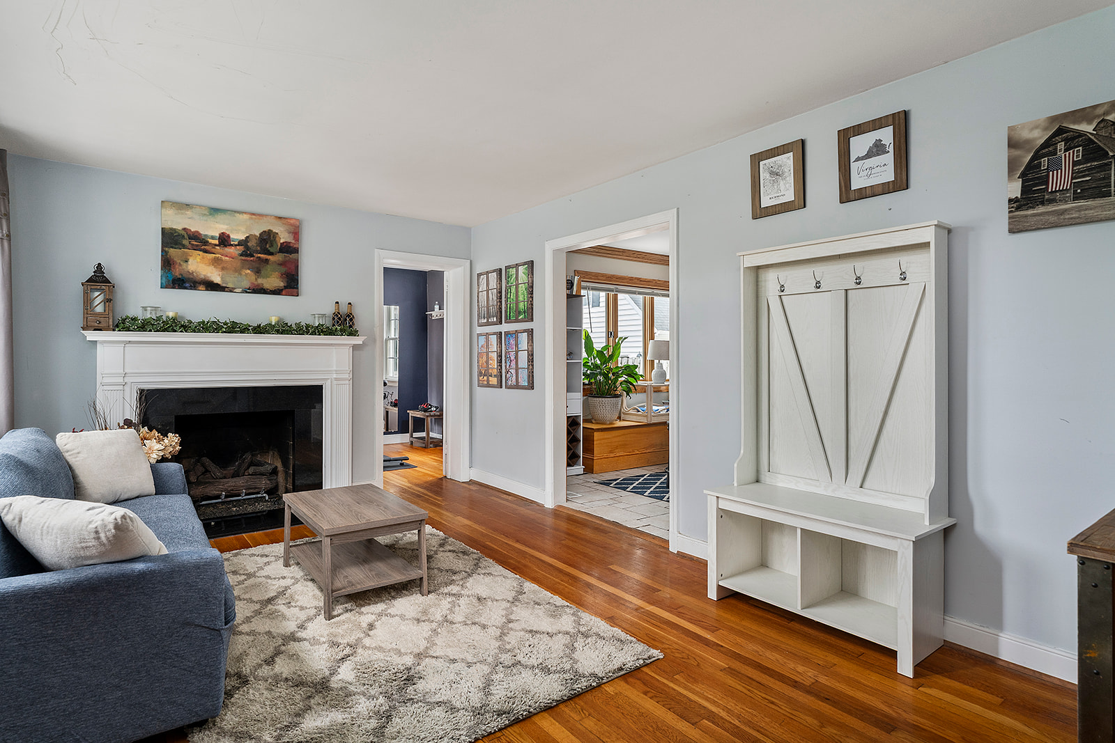 Foyer: Bright and inviting space with a charming fireplace and stylish decor!