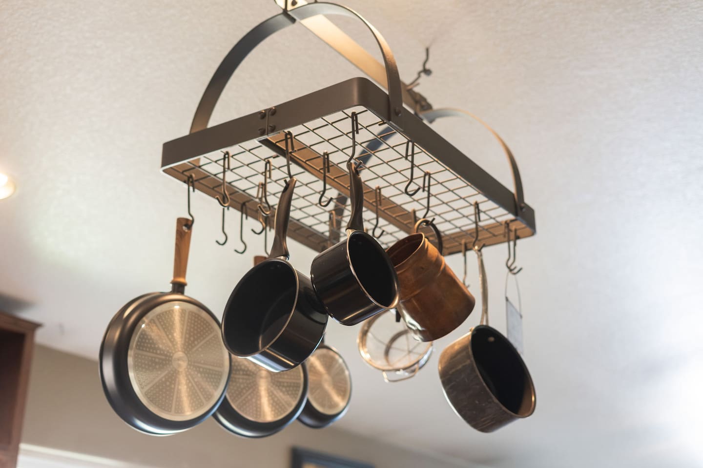 A fully stocked hanging pot rack means you'll have the right cookware for every dish — no need to pack a thing.