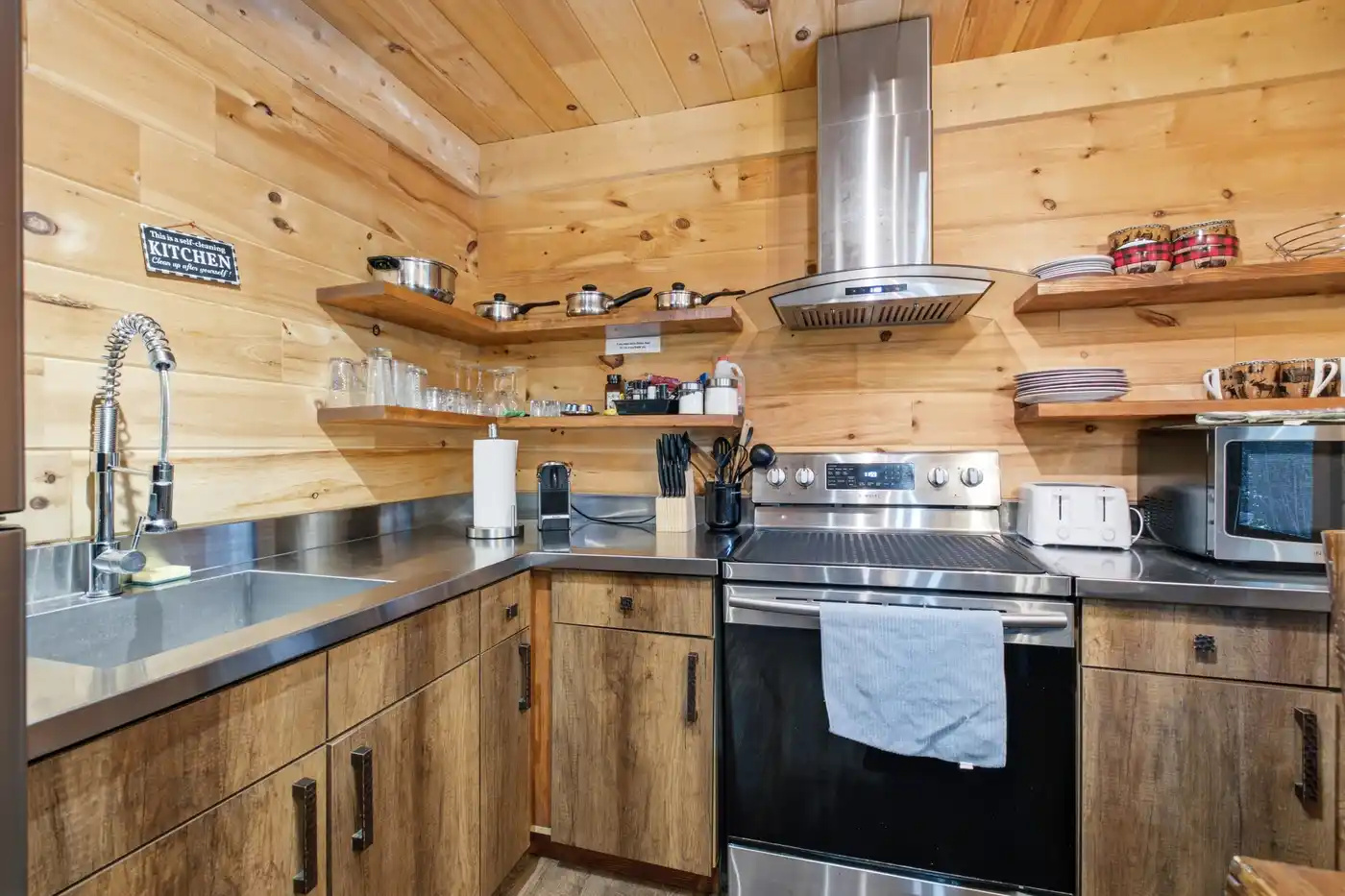Fully equipped kitchen with rustic cabinetry and modern appliances