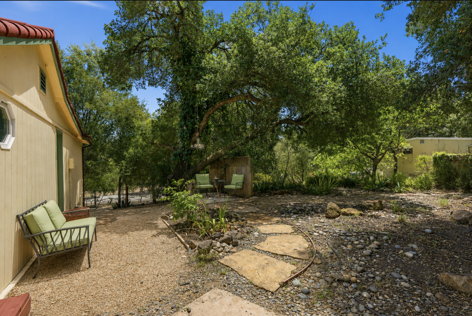 Peaceful garden surrounded by mature trees