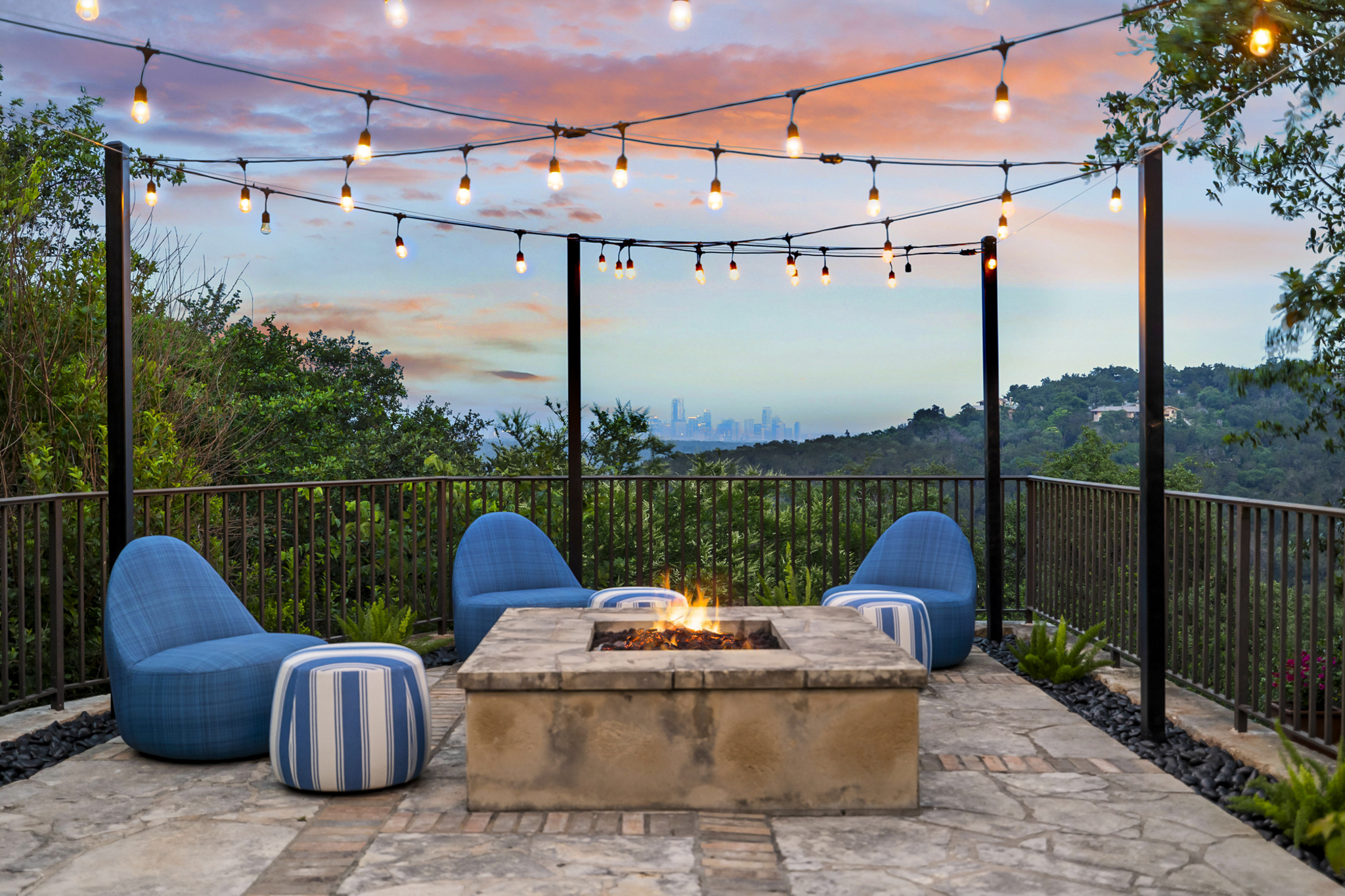 Poolside Lounge and Firepit overlooks the city skyline.