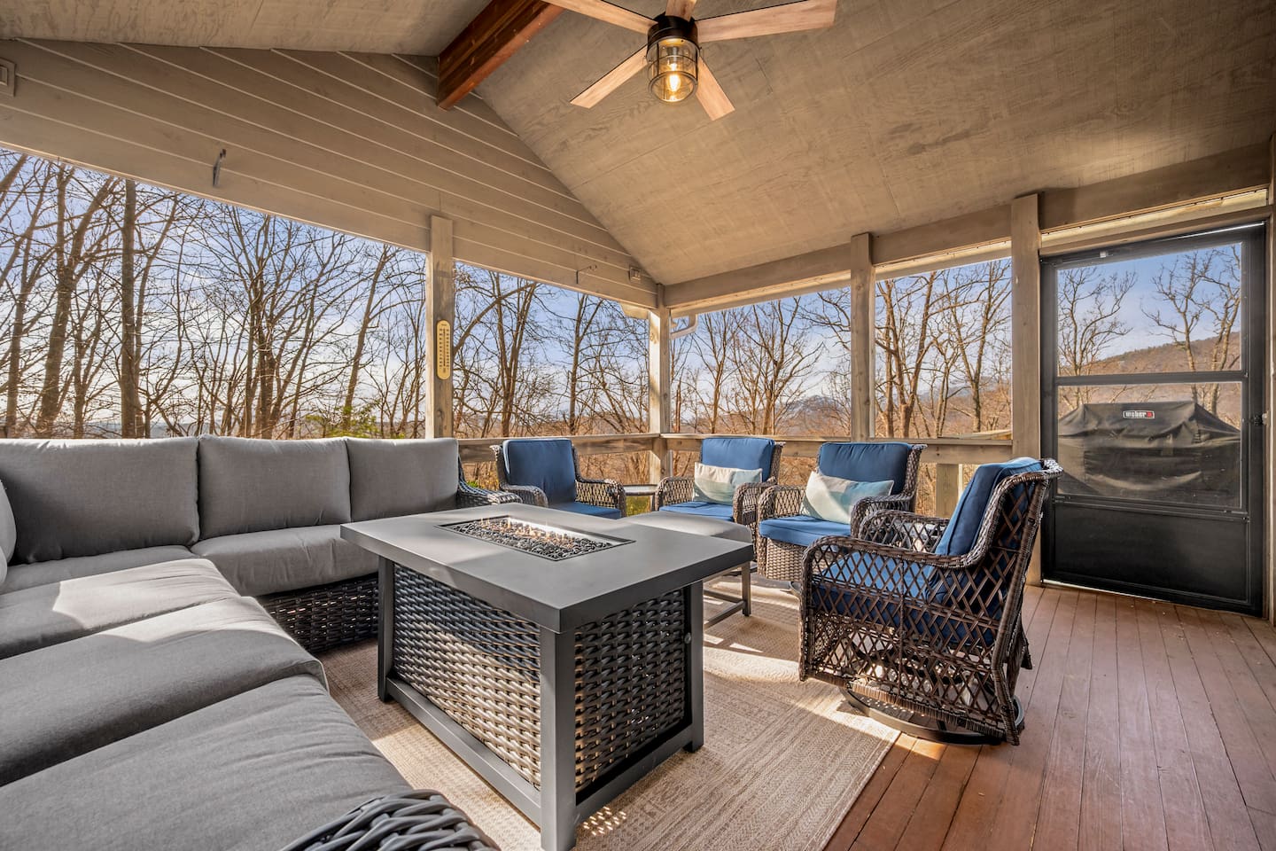 Open screened in porch with seating, tv, and more