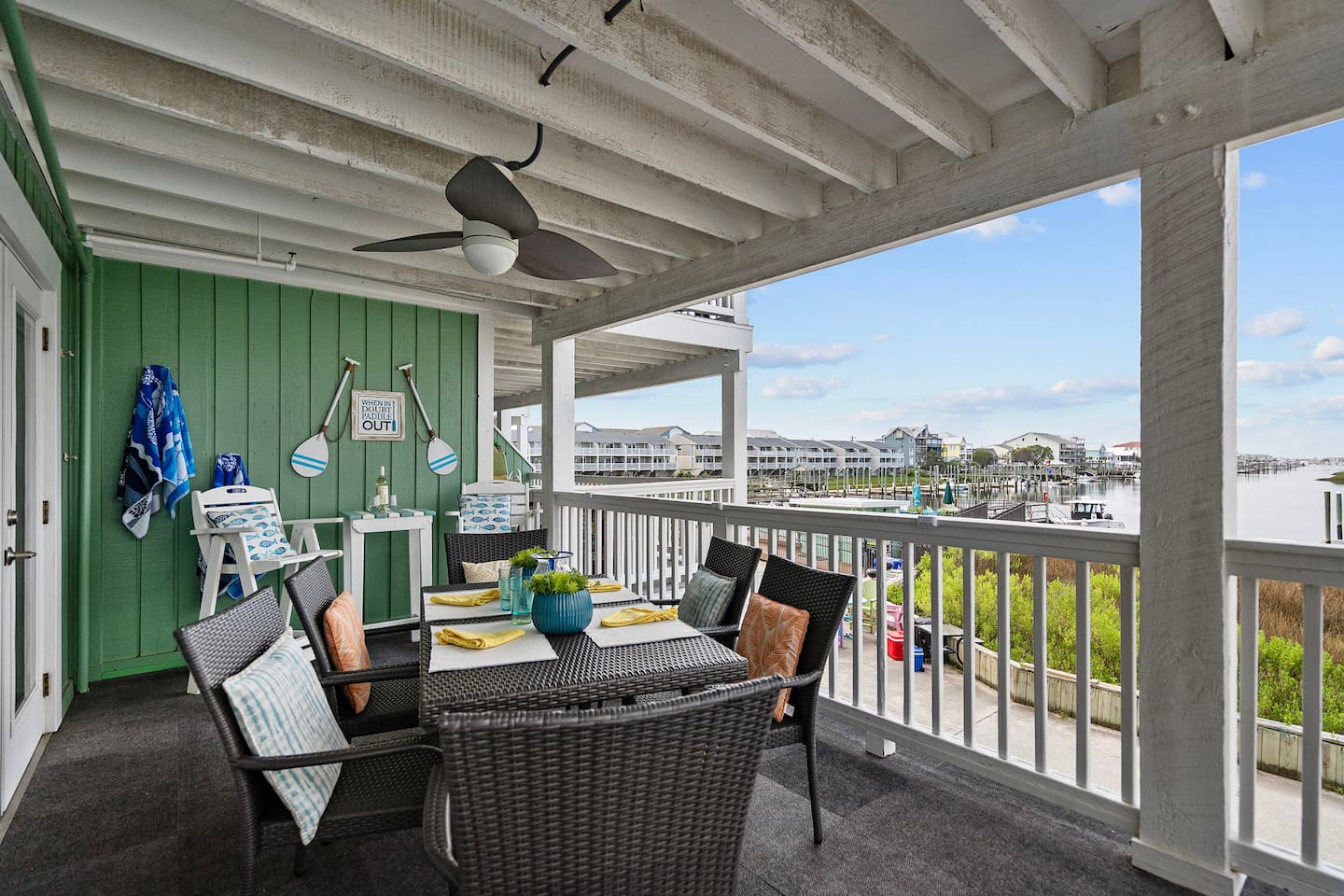 Back porch with additional seating for 6 and stunning views of the canal. Watch the sunset and fireworks in the summer. 