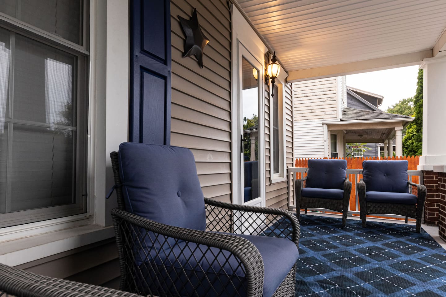 FABULOUS front porch with comfy chairs and a SPECTACULAR  view of Lake Erie