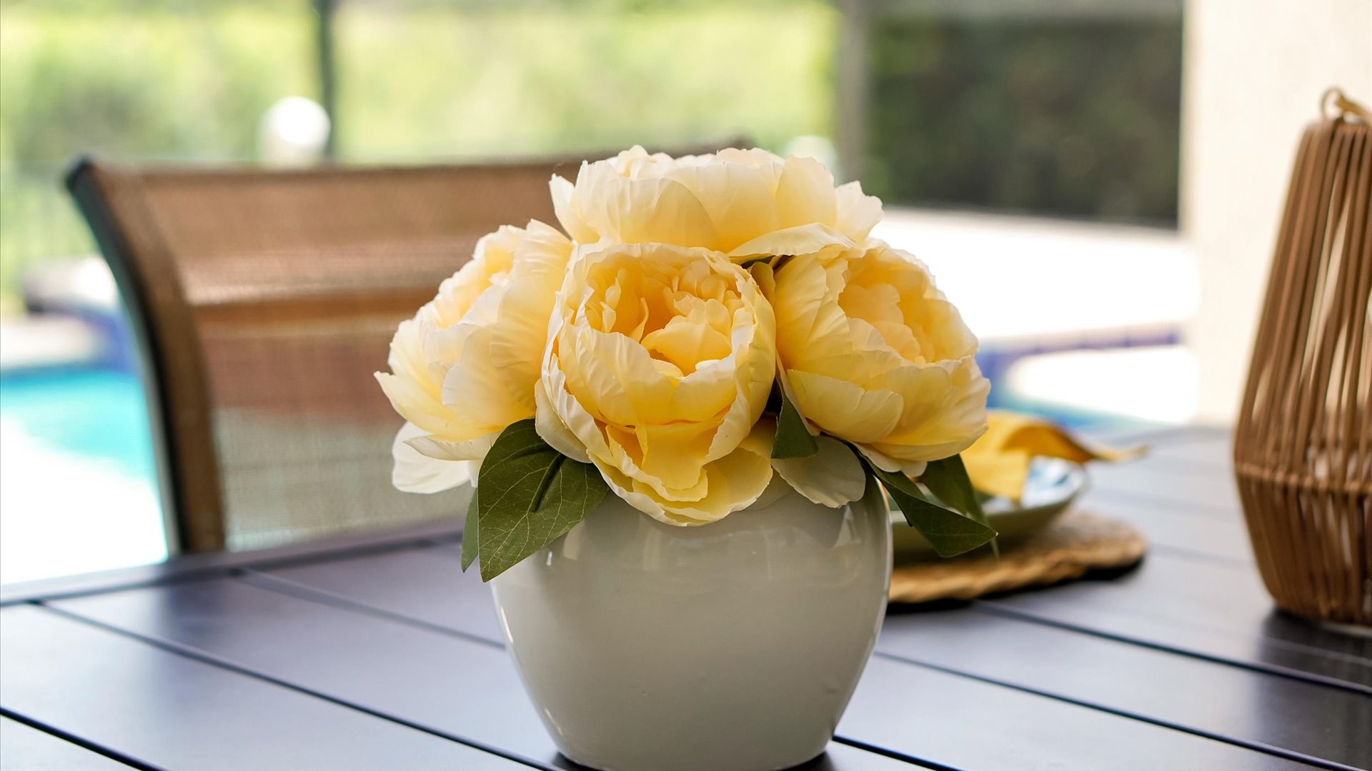 Poolside Lanai: Thoughtful tropical touches create a welcoming place to relax beside the pool.