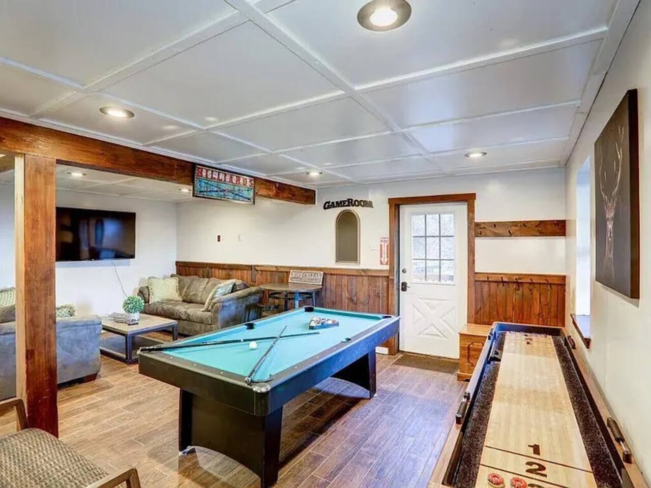 Game room / play area with pool table and shuffle board