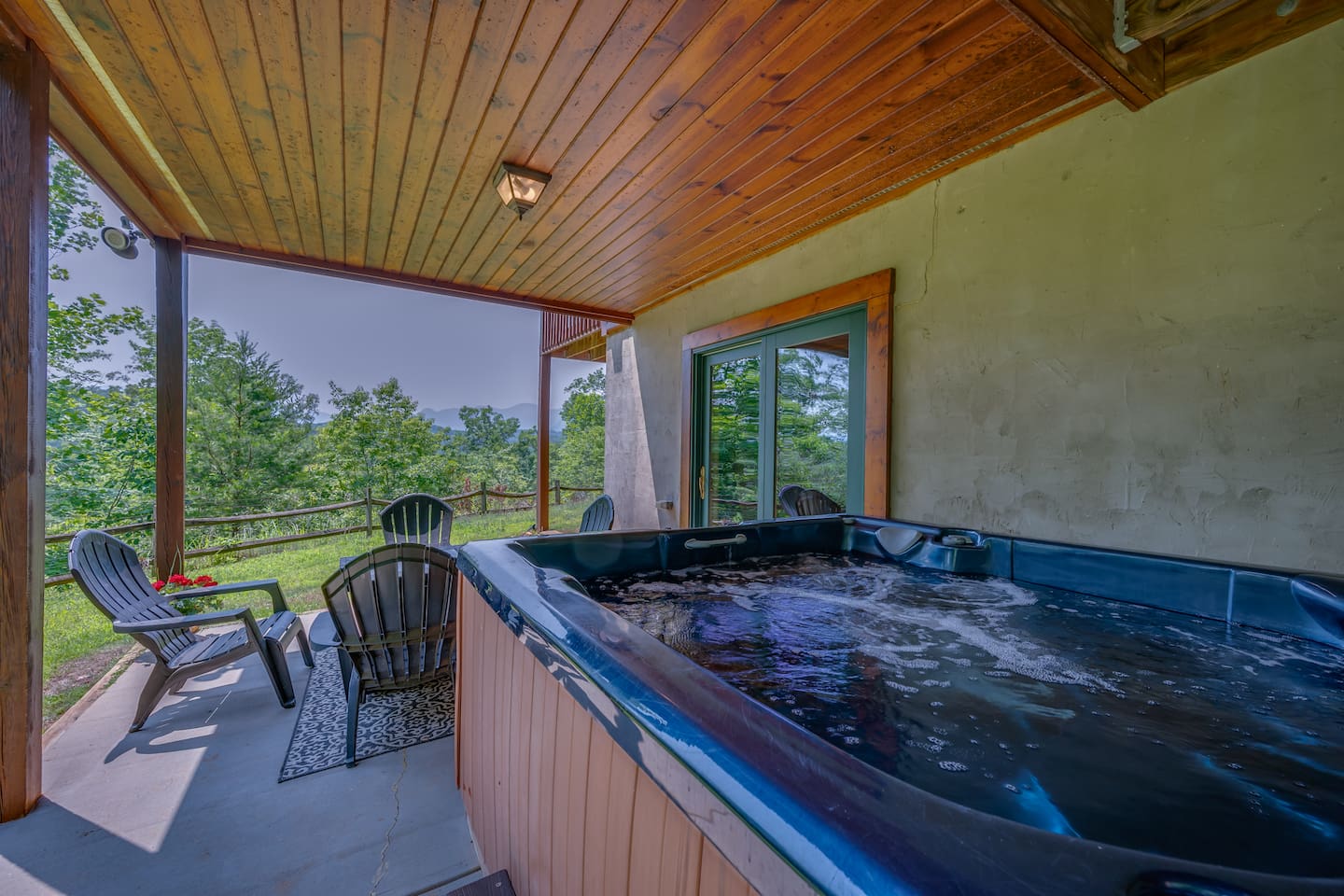 Hot tub with fire pit. Enjoy the beautiful views surrounded by nature in the hot tub!