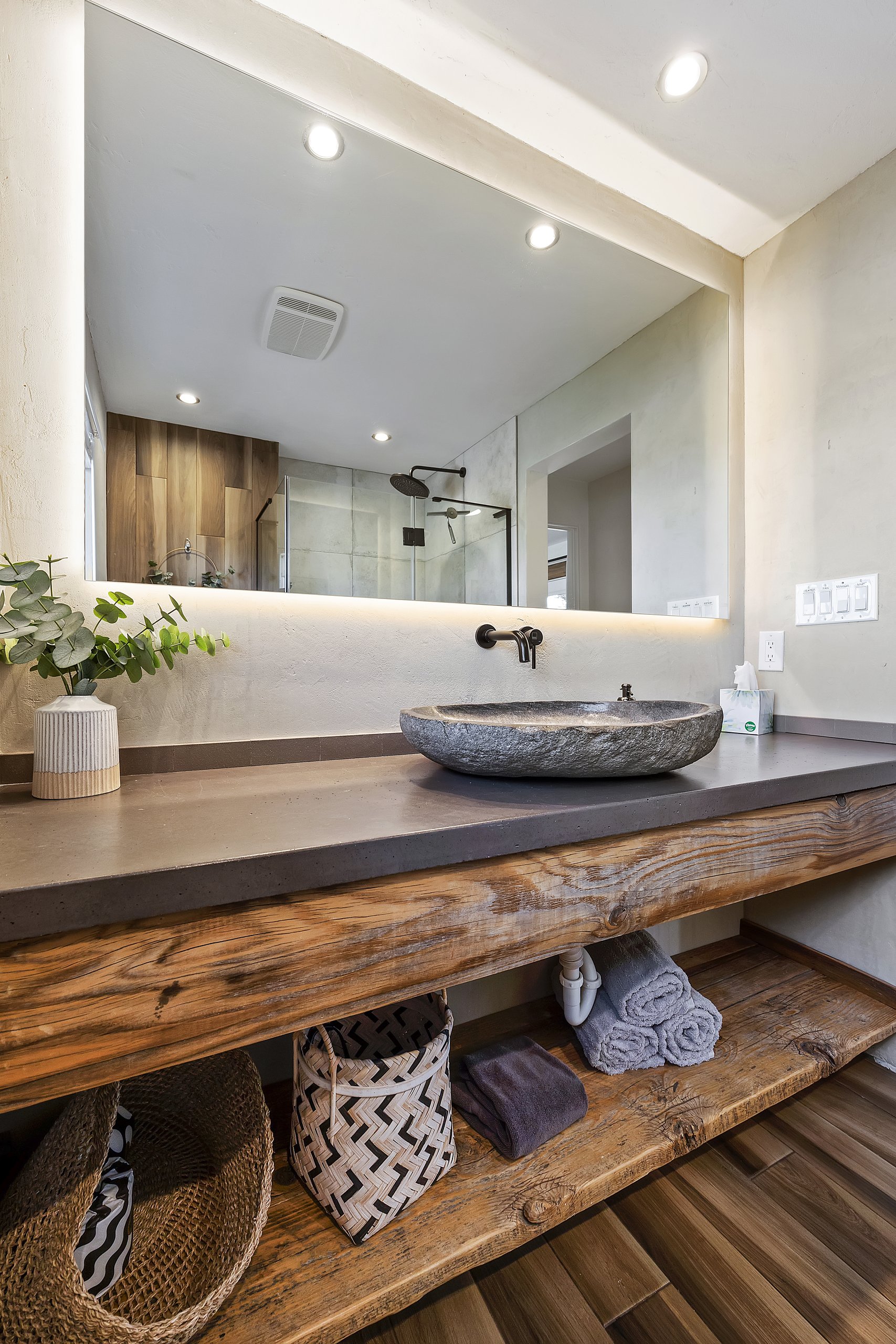 Full bath with vessel sink and plush towels, stocked for guests
