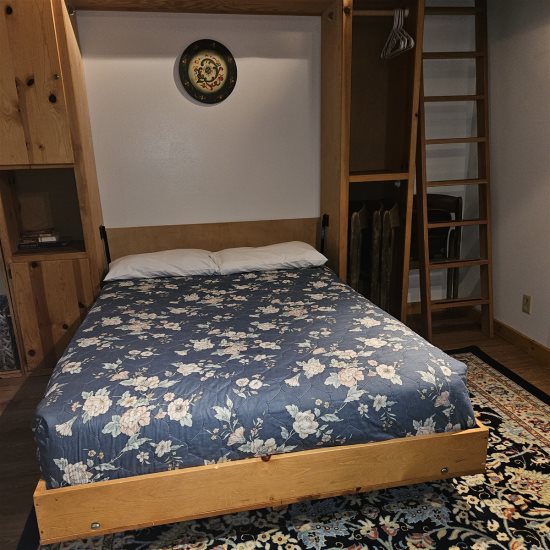 Pull-down murphy bed: Full-size bed.