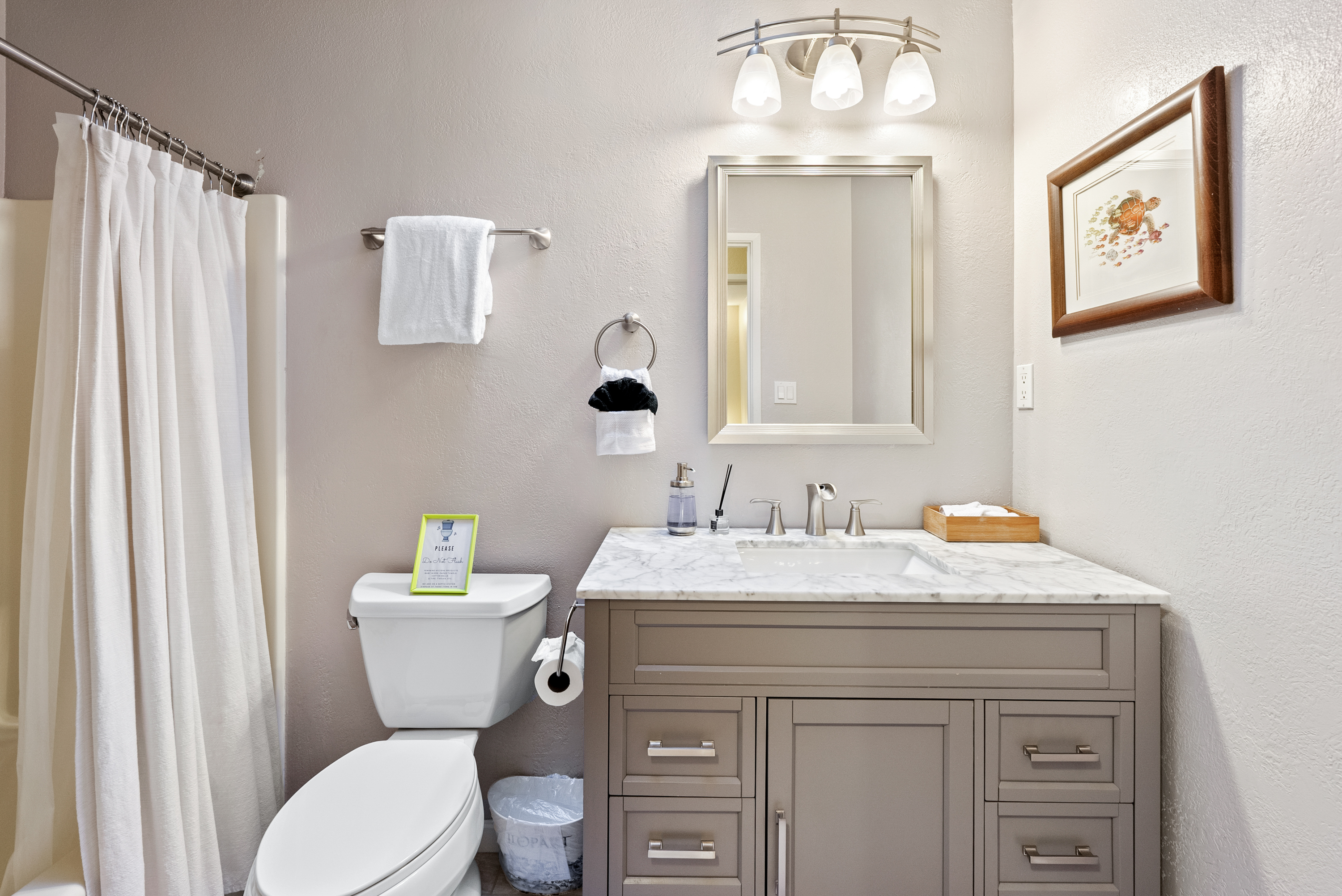 A sparkling clean bathroom stocked with essentials for a worry-free stay.
