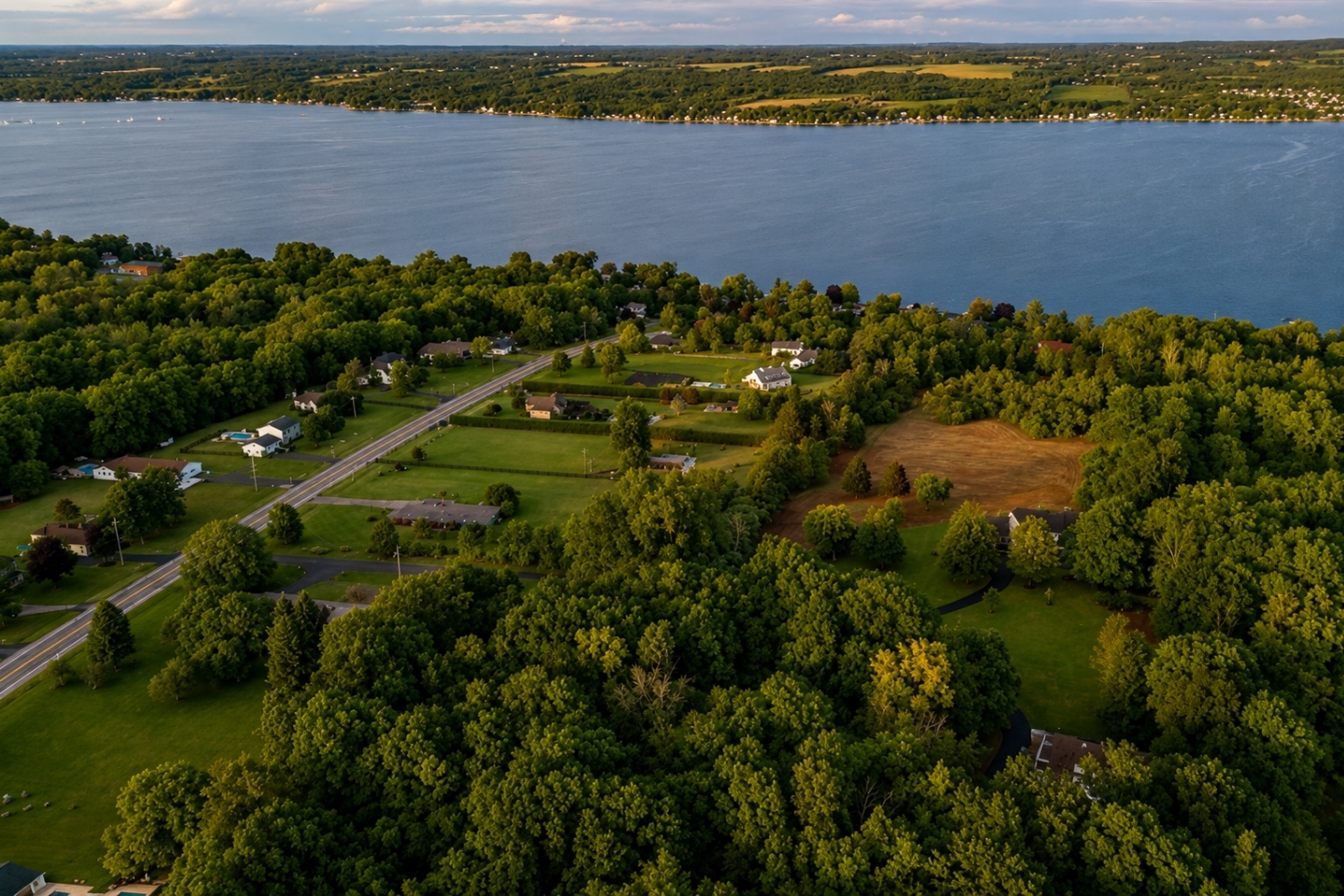 Stunning aerial view showcasing the serene beauty of the lake, lush greenery, and peaceful surrounding neighborhood. Perfect for highlighting location and natural setting.