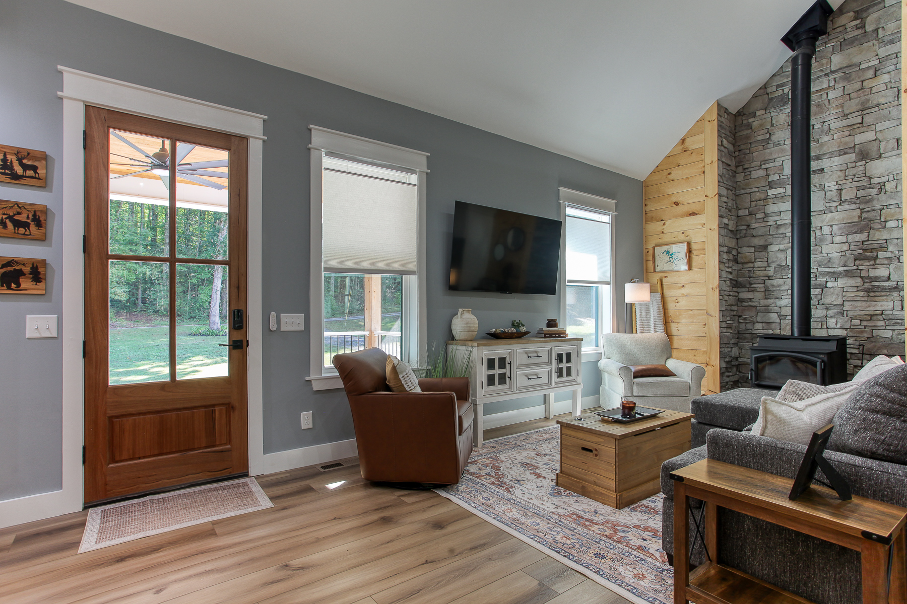 Settle into the inviting living room at Robbin’s Nest on Snowbird Creek, with comfortable seating, a smart TV, and natural light.