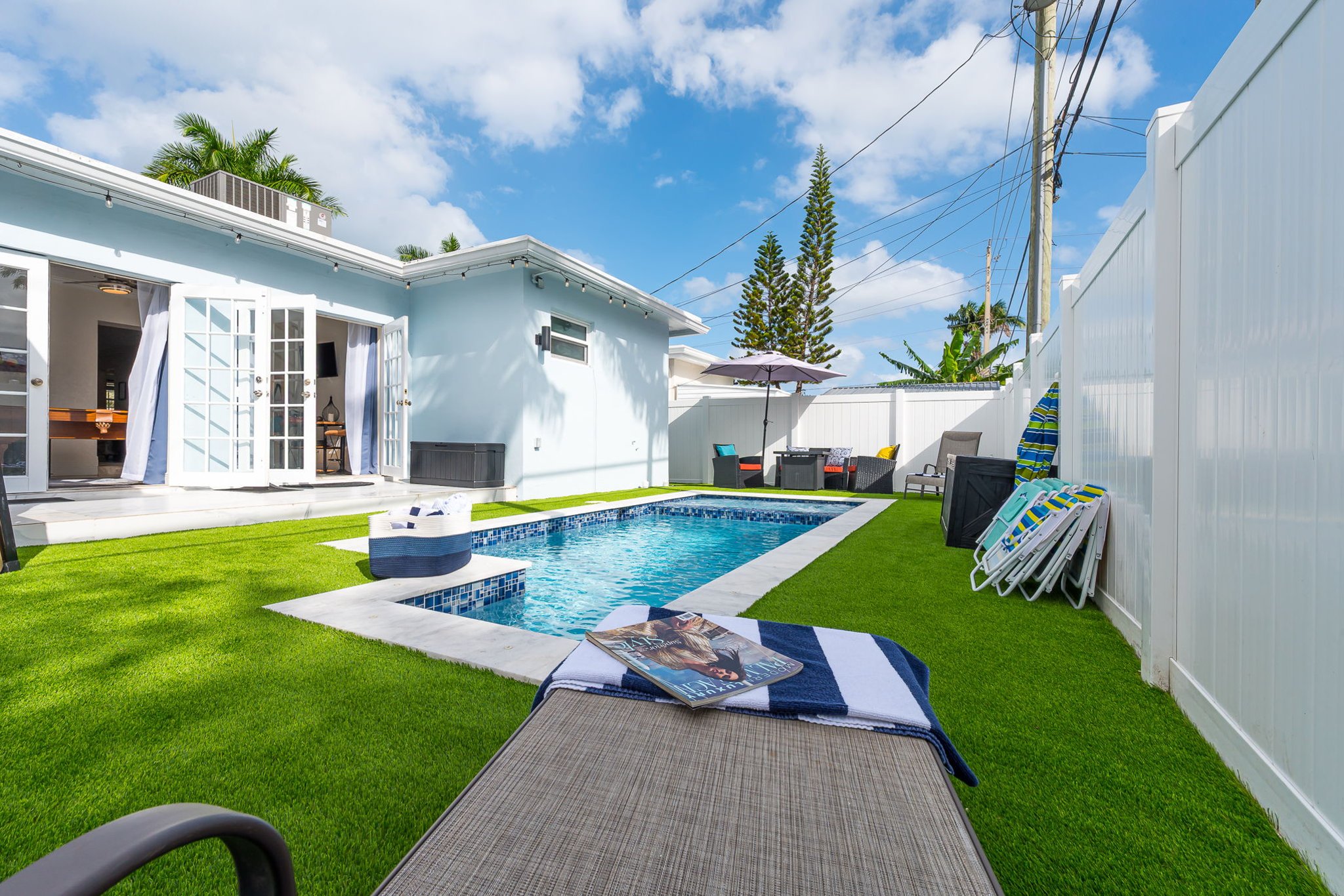 Enjoy your own private pool and hot tub, gas fire pit lounge, outdoor dining, and games—ideal for families and groups seeking a fun Florida escape.