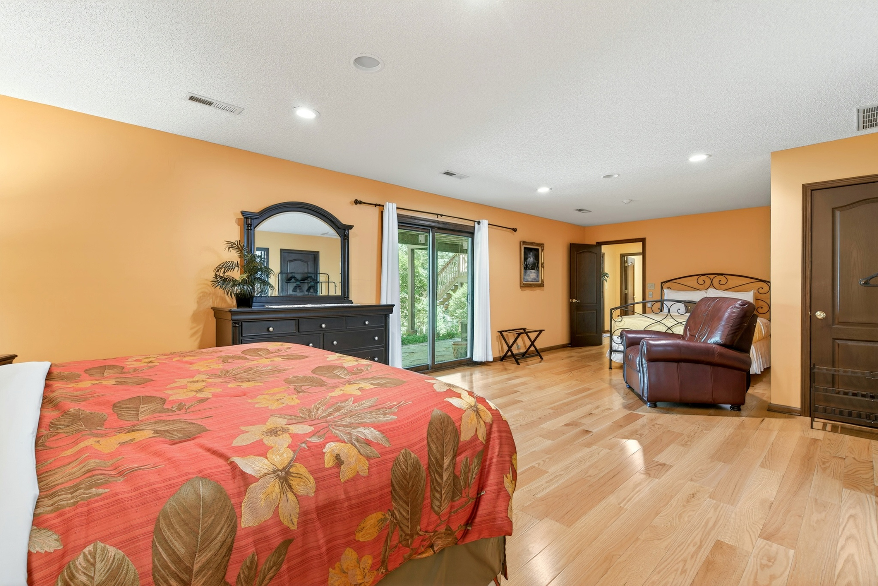 Lower level master bedroom also has a queen size bed and access to the backyard