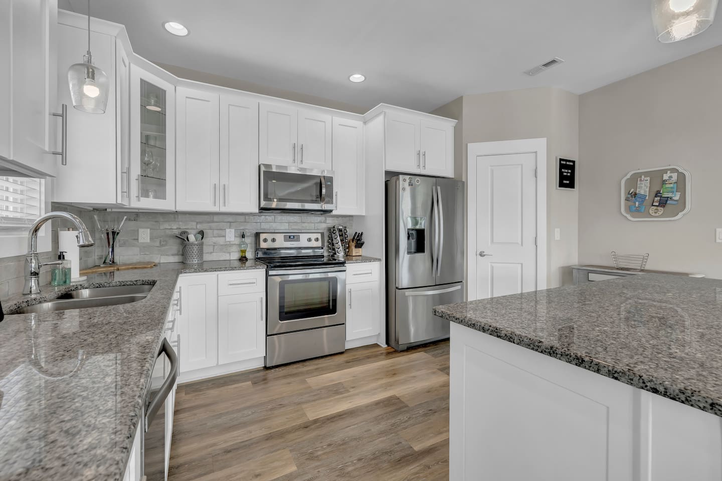 Spacious kitchen with large island, and a roomy pantry.