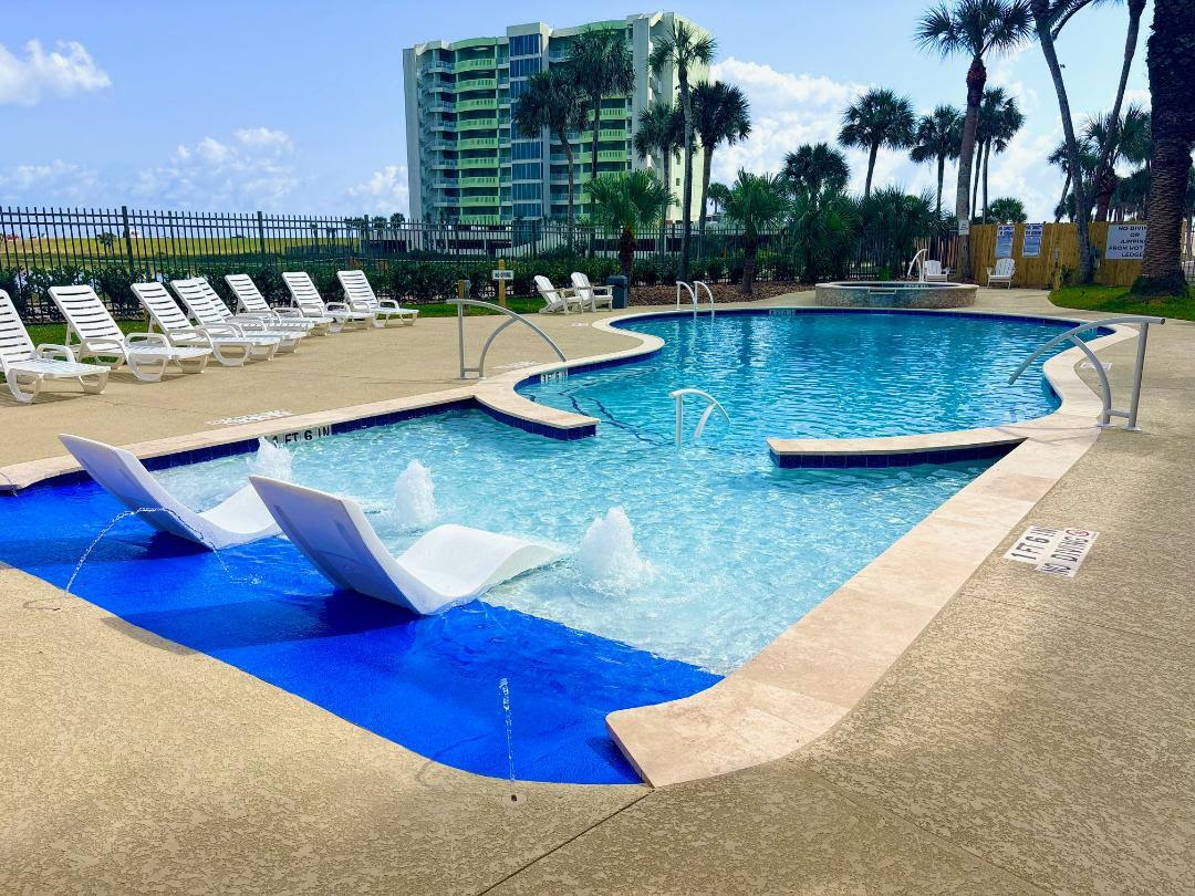 East, heated pool, with splash pad, tanning ledge