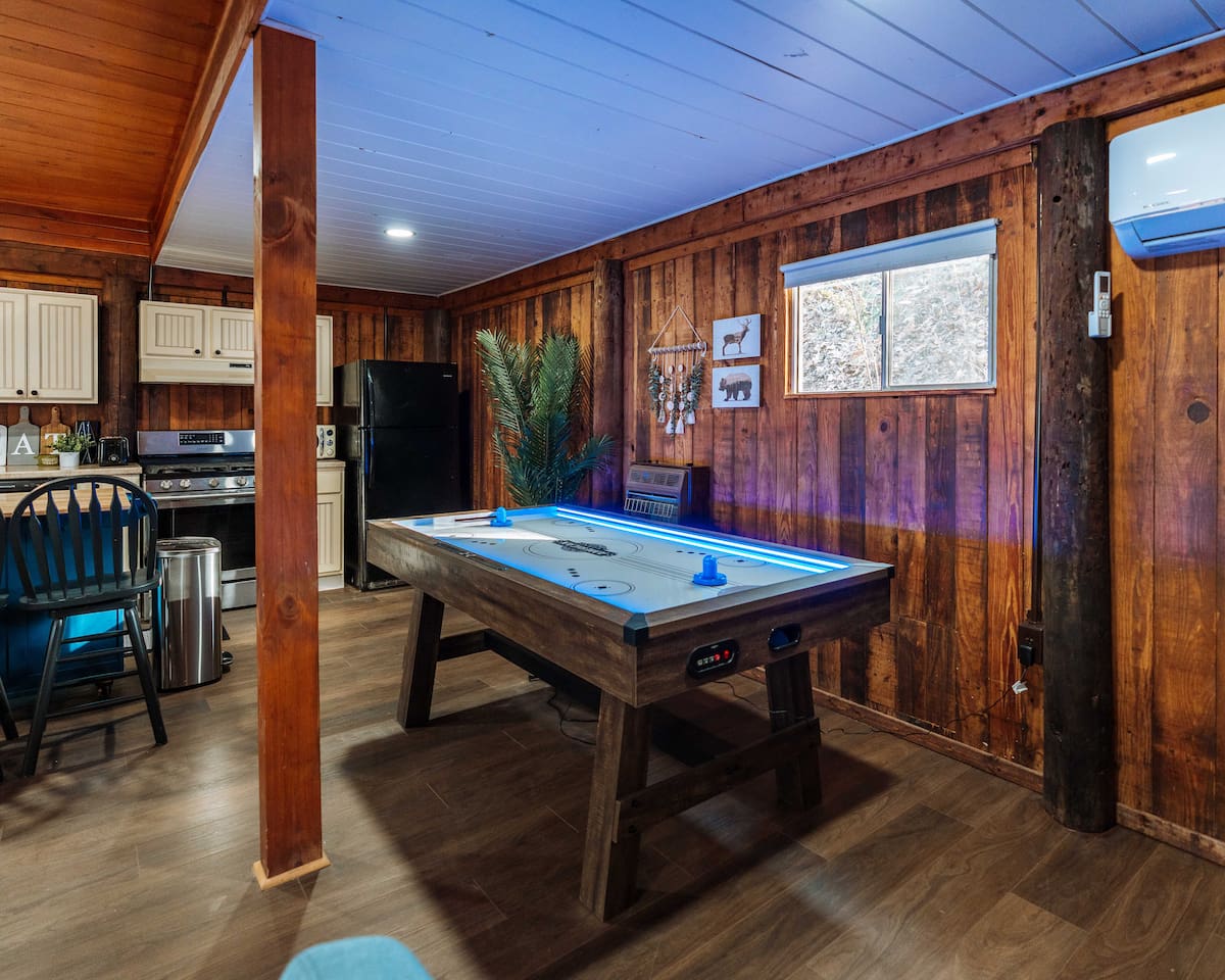 Level up your getaway with high-energy air hockey matches overlooking the forest