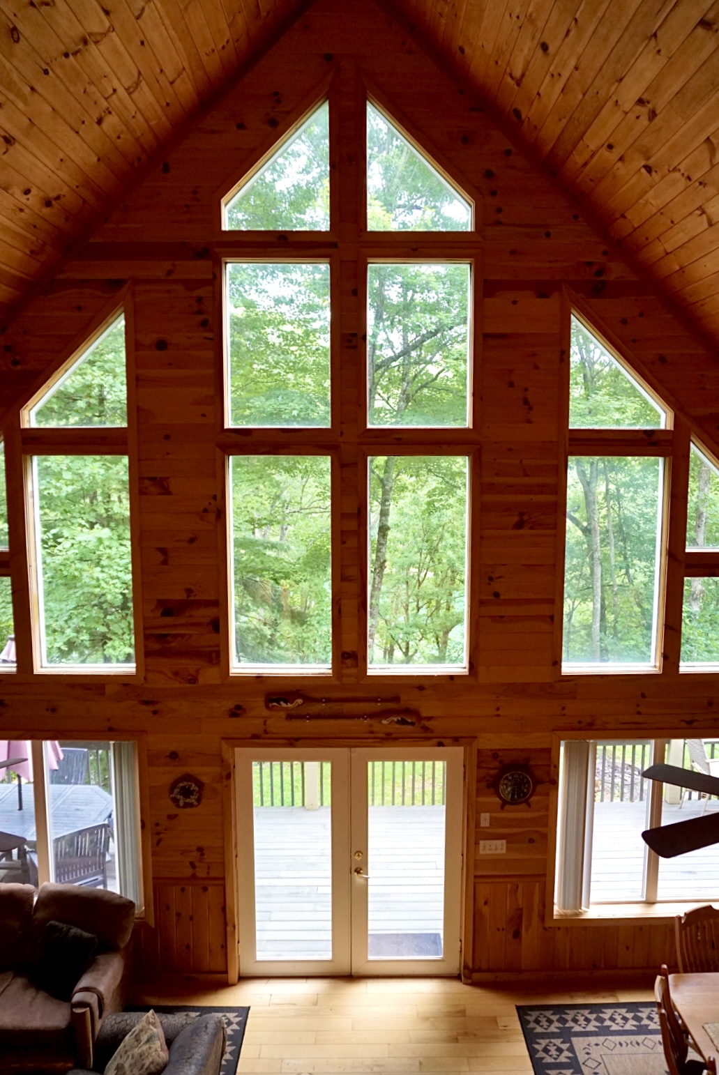 Towering windows frame stunning forest views, inviting nature inside for your escape!
