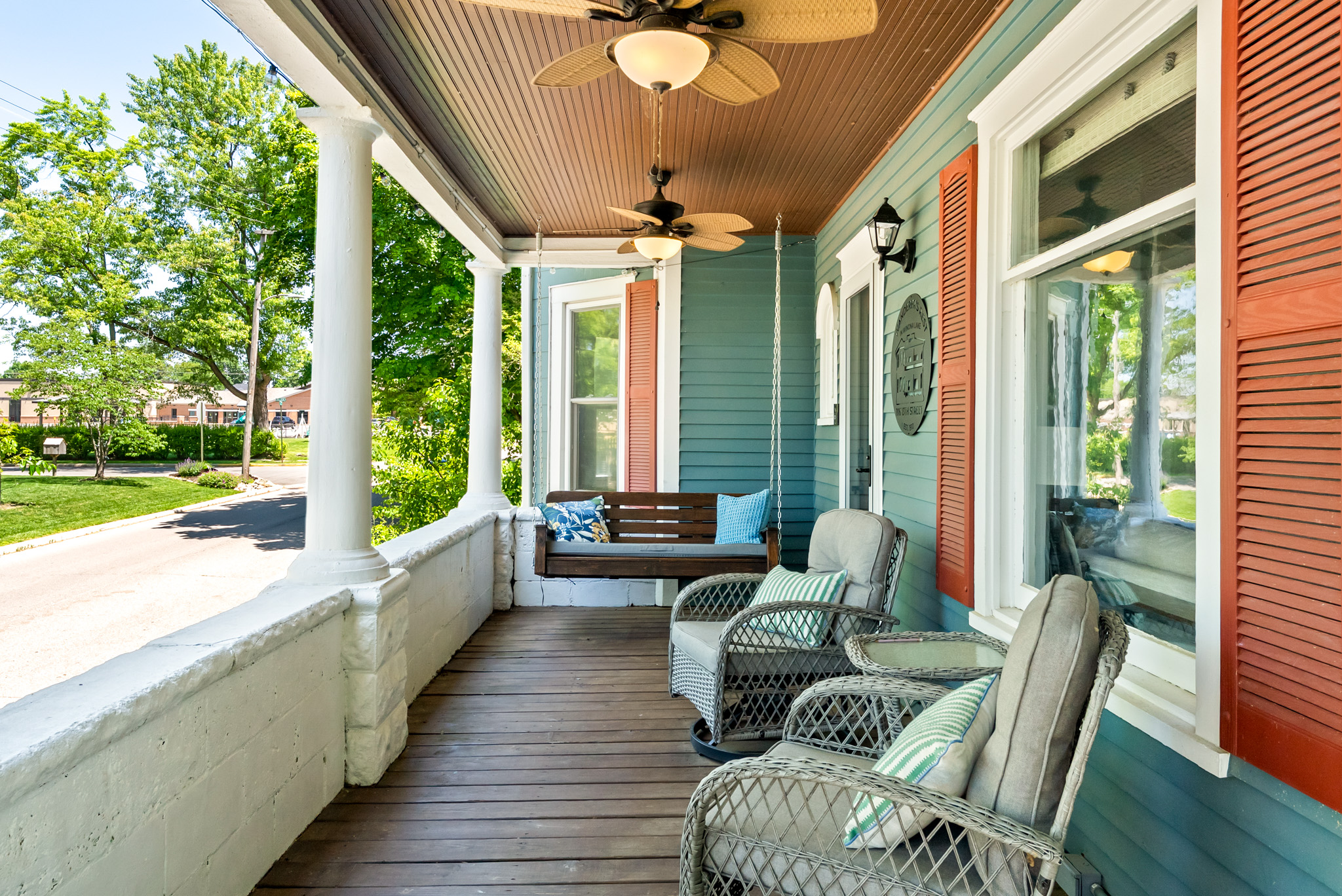 Pour a glass of wine or grab a good book. This shaded front porch swing offers a peaceful, old-school neighborhood vibe just a short walk away from the beach and village shops.