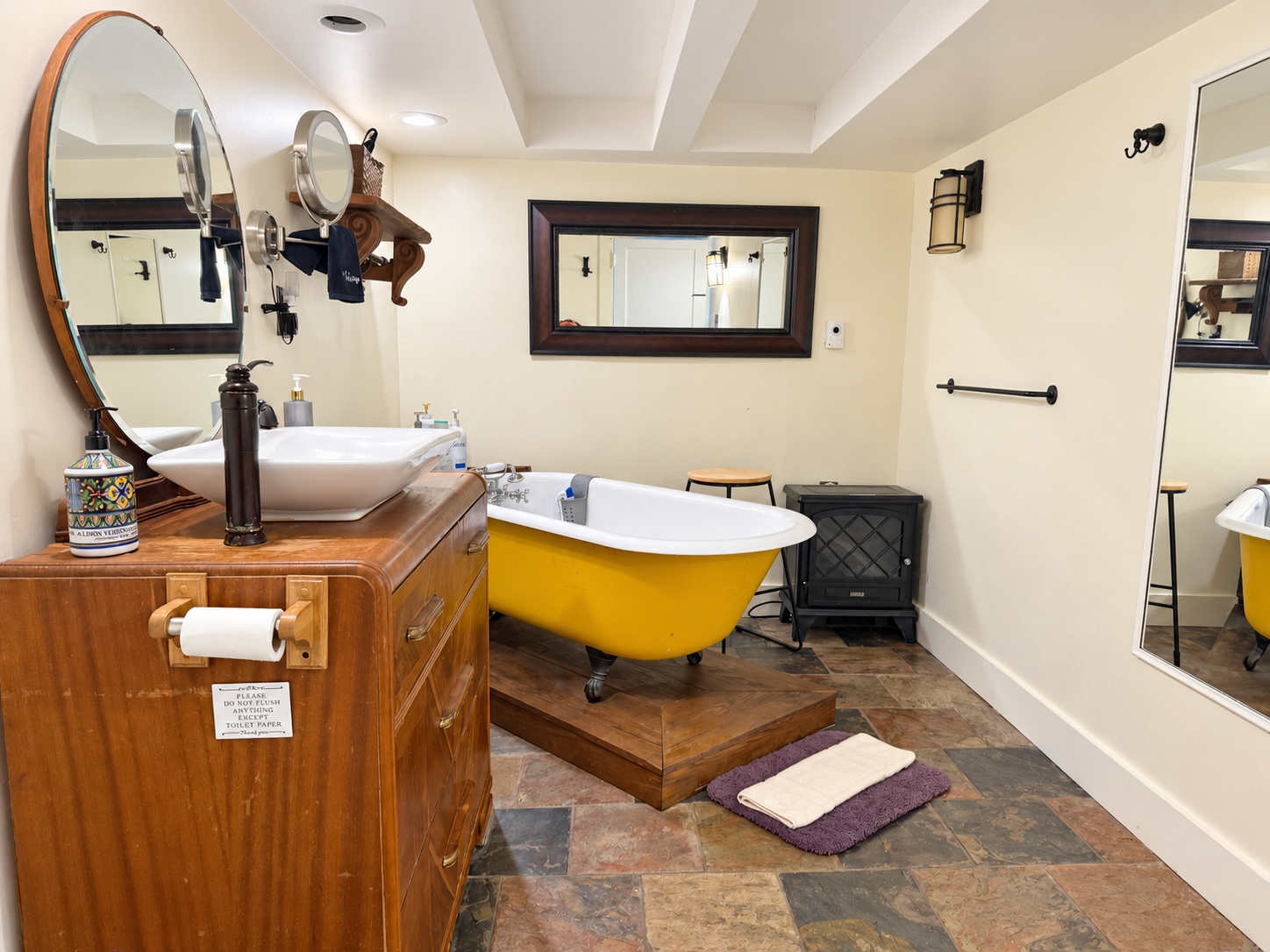 Bath w/ vintage clawfoot tub on lower level next to game room
