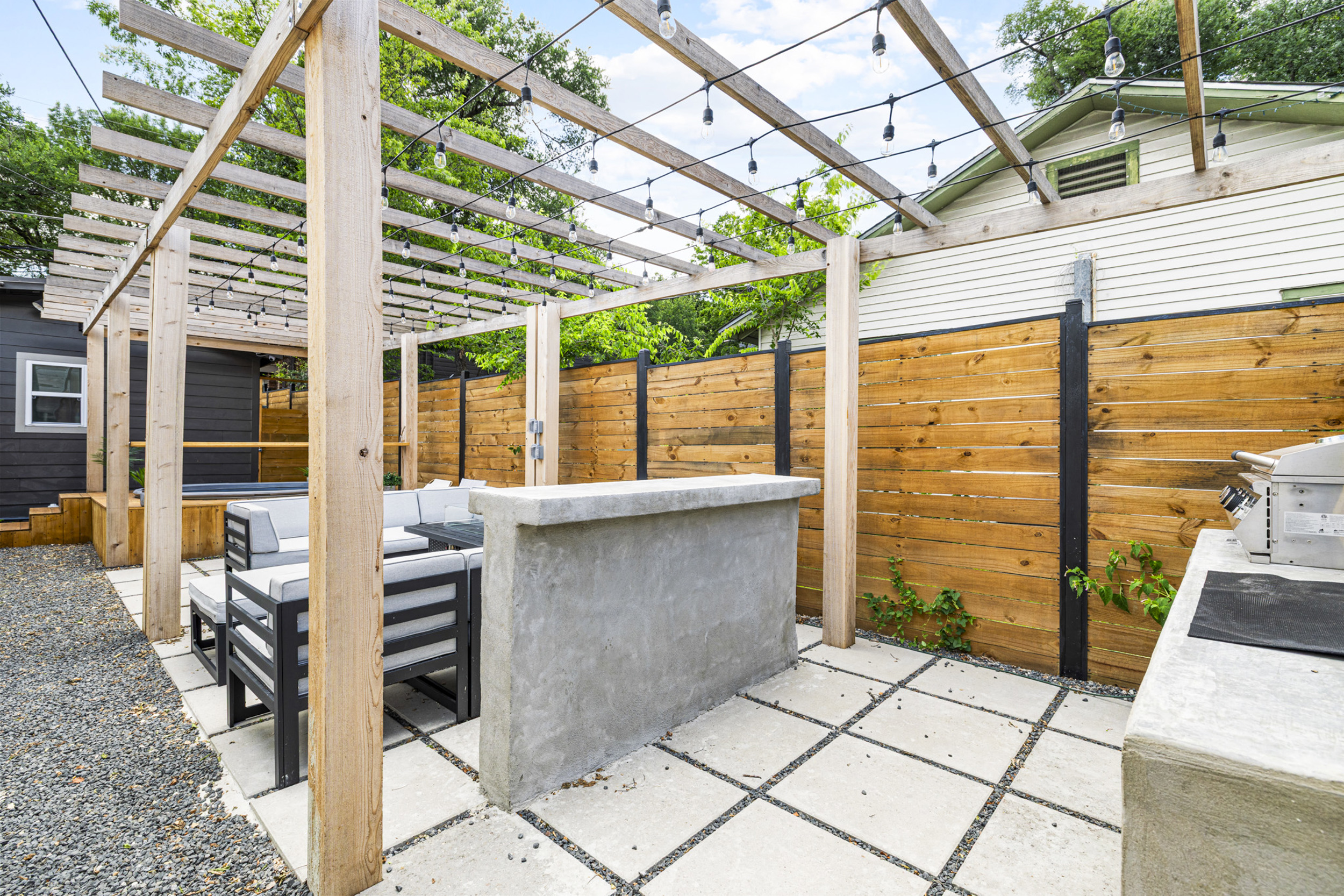 Enjoy al fresco dining under twinkling lights and unwind in style!