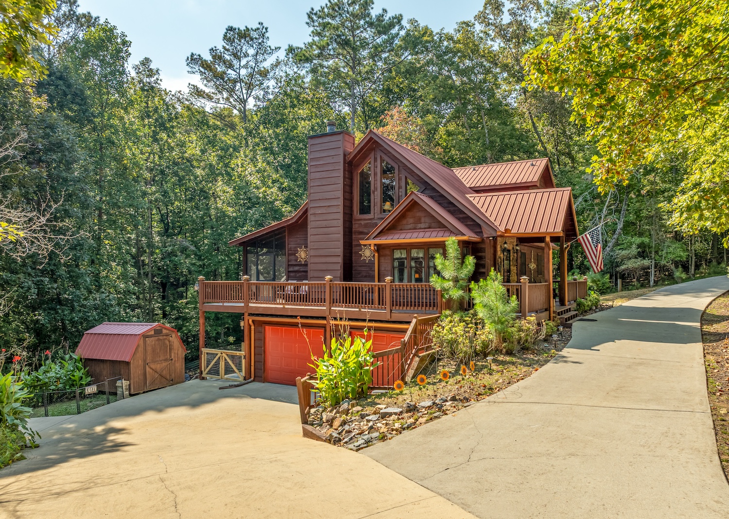 Driveway accessible from both sides for easy and convenient in and out. More parking in front of the garage doors and right next to the little garden area.
