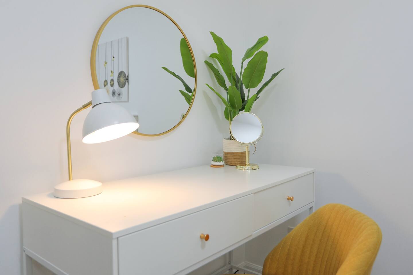 A cozy workspace awaits with a desk, chair, and lamp, perfect for catching up on emails or planning your Savannah adventures.