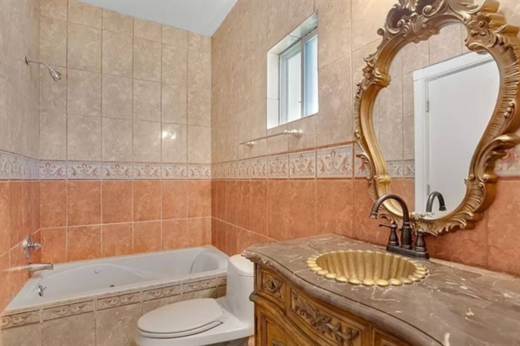 Soft lighting and earthy tilework create a warm, welcoming vibe for your morning routine or evening wind-down.