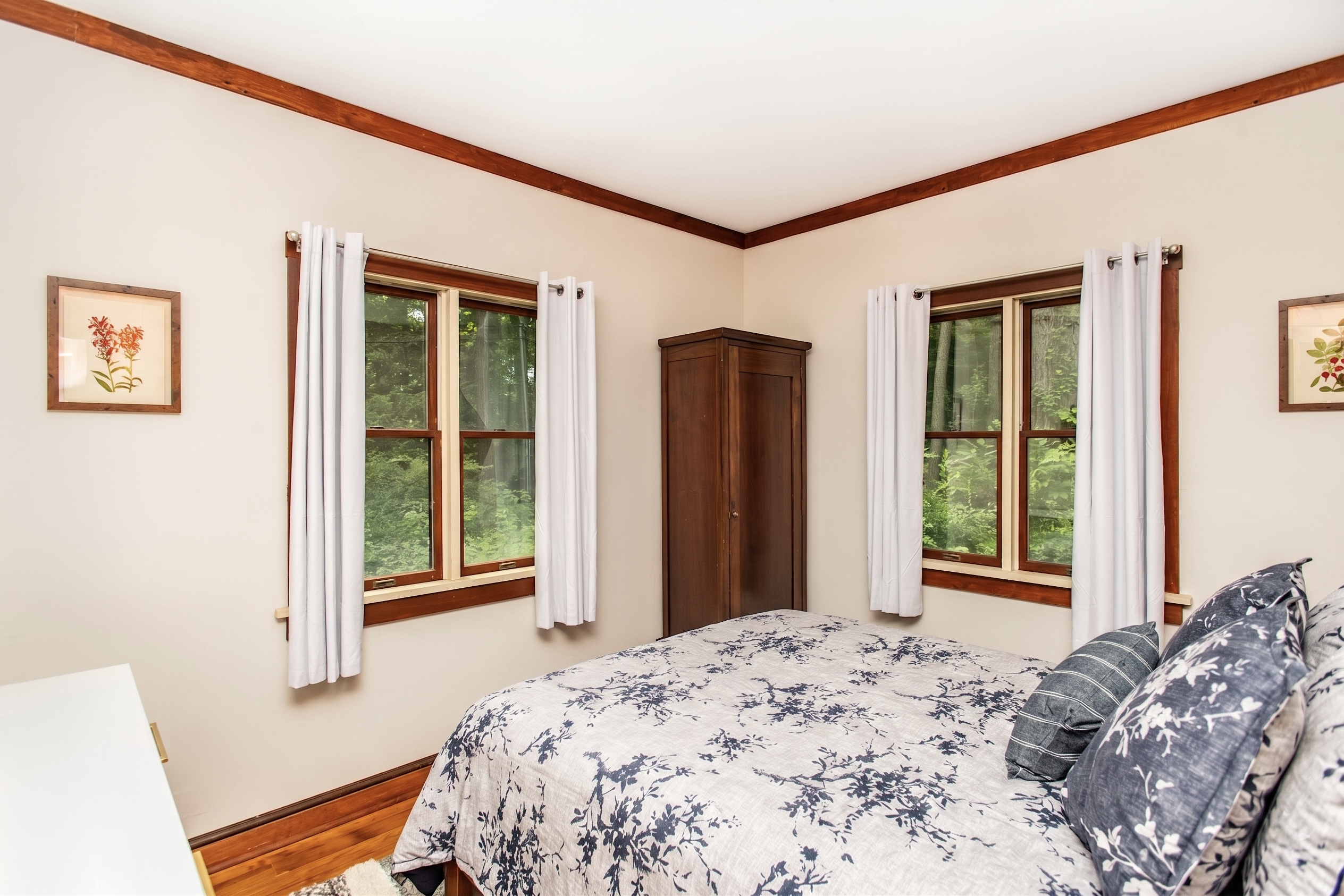 Bedroom with wooded views and a wardrobe for your things
