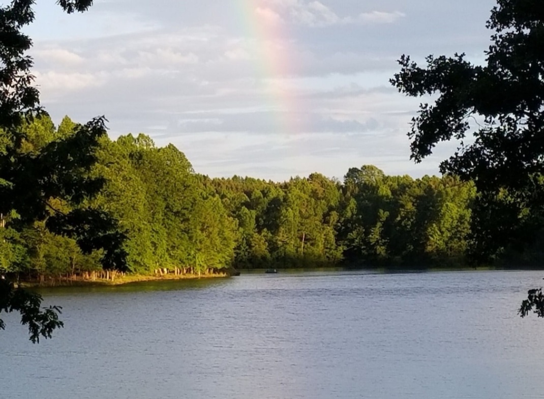 After a summer shower, you might catch a rainbow stretching across the lake from the boathouse deck.