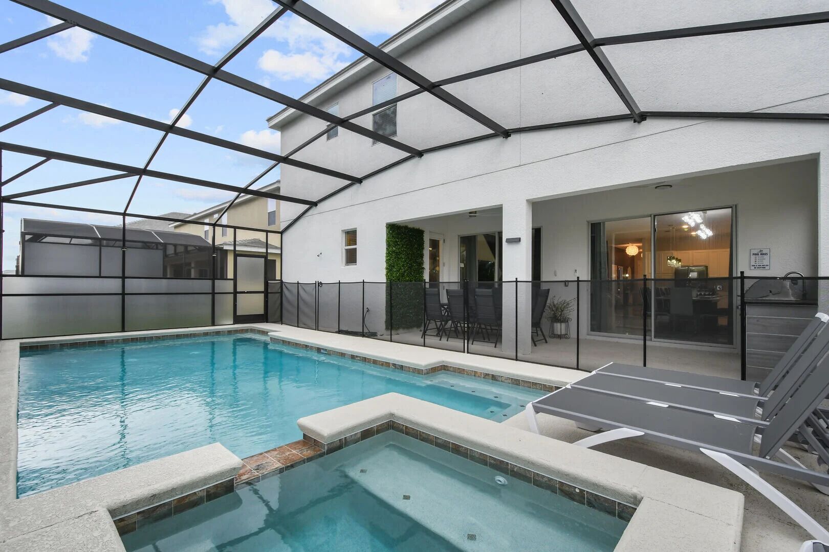 Unwind in style with a private pool, hot tub, BBQ kitchen, and ample seating—your ultimate outdoor oasis!