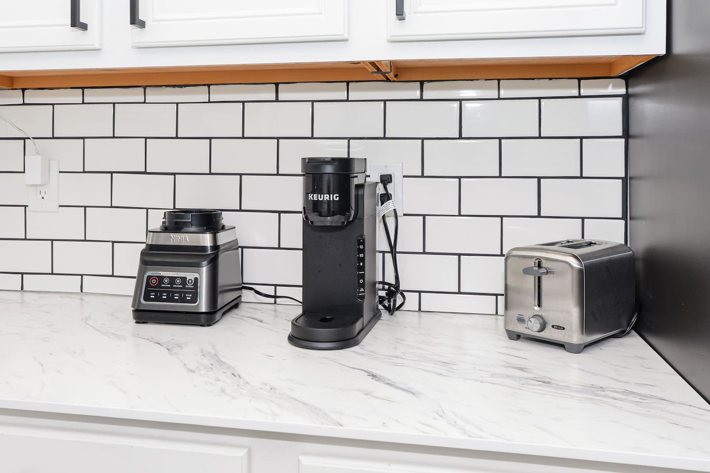 Keurig coffee maker, blender, and toaster for your convenience, perfect for preparing breakfast or a quick snack.