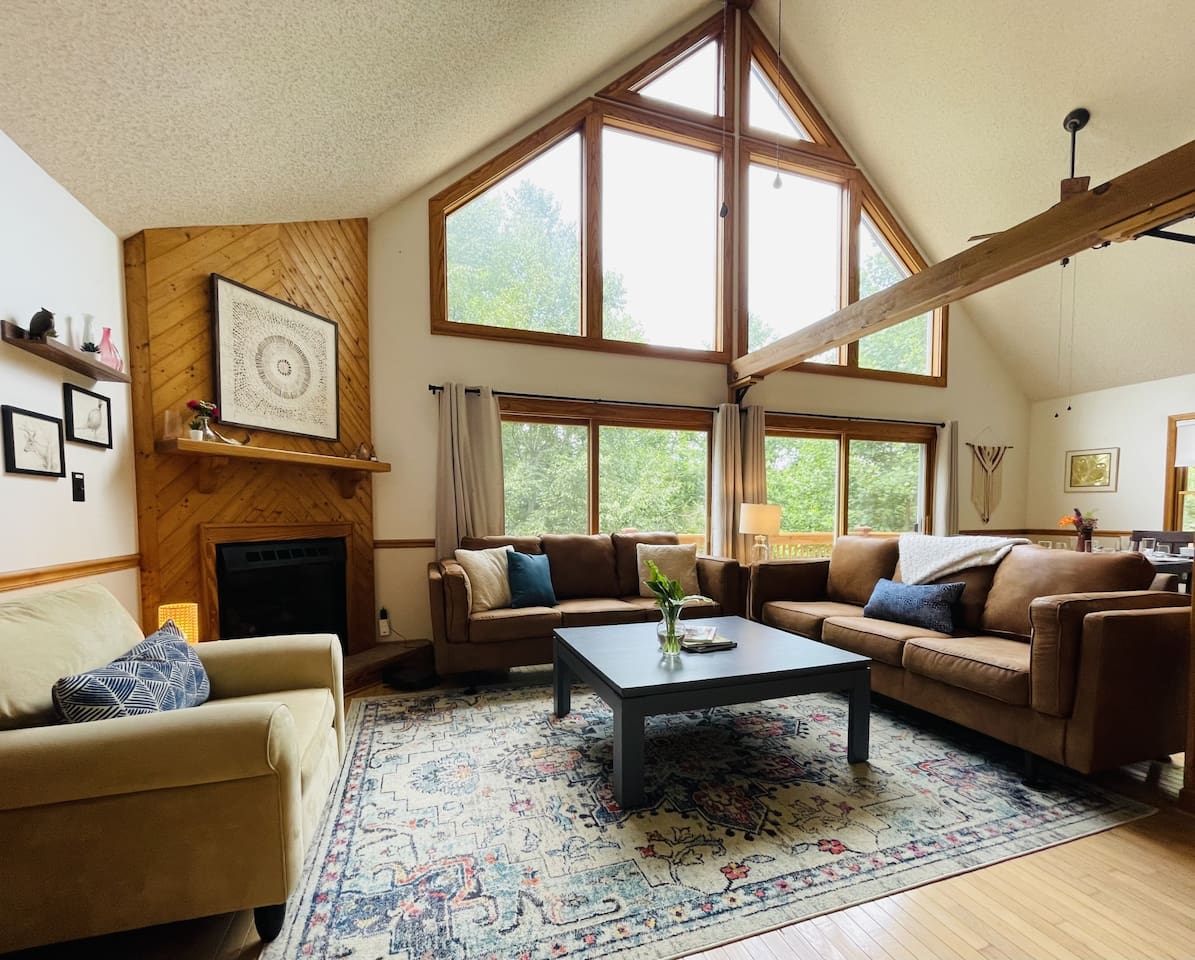 Light filled open living area with big picture windows and easy access outdoors, super comfortable in all seasons