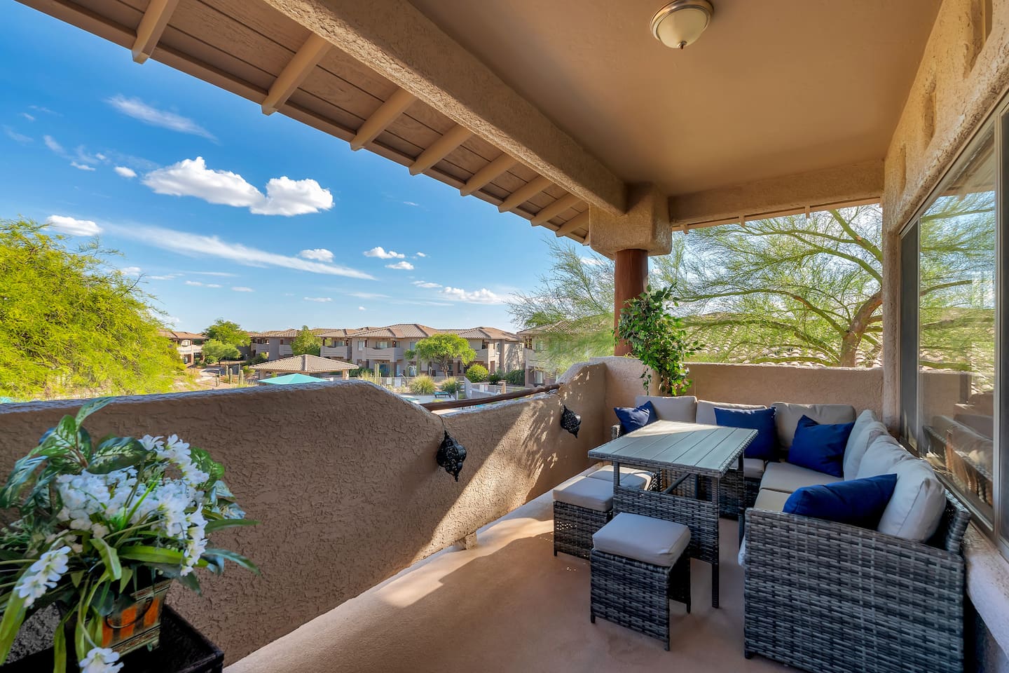 Private balcony with direct pool view, gorgeous mountain views, and comfortable outdoor dining/seating