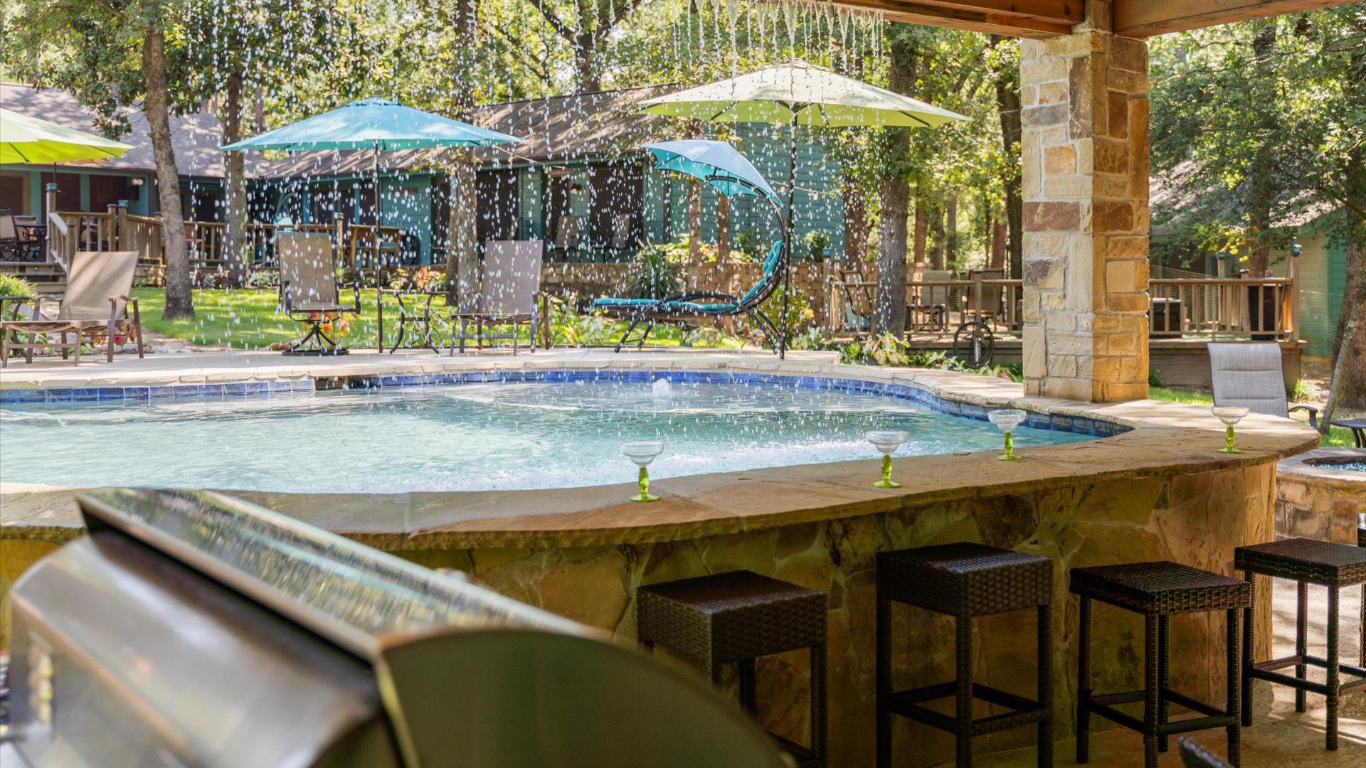 One of the most unique features of the pool is the beautiful rain curtain that flows gently over the swim-up bar. It’s not only a stunning visual, but also a fun splash zone for the kids.