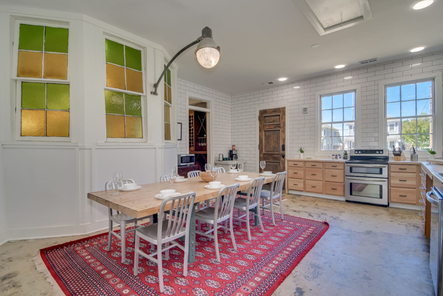 Dining hall with long table, perfect for group meals and celebrations.