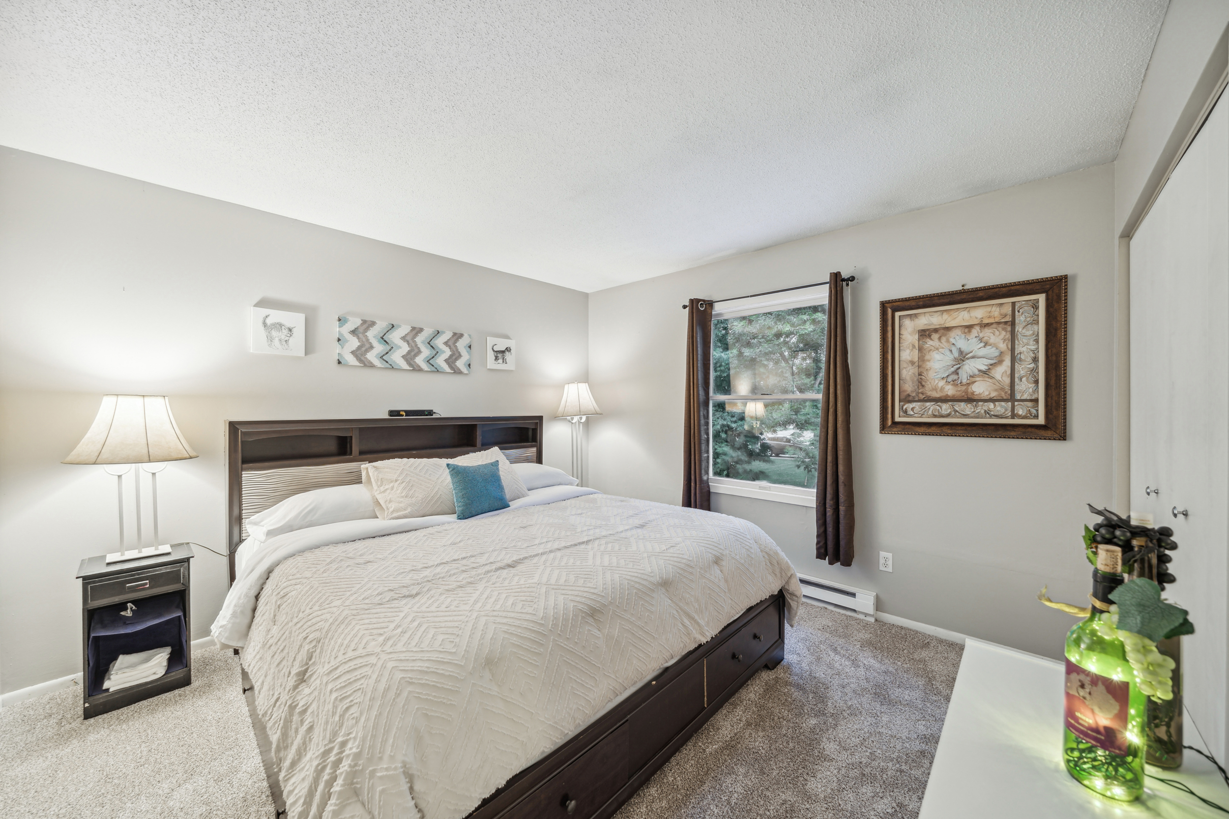 Enjoy this comfortable king-sized bed just off the restroom.