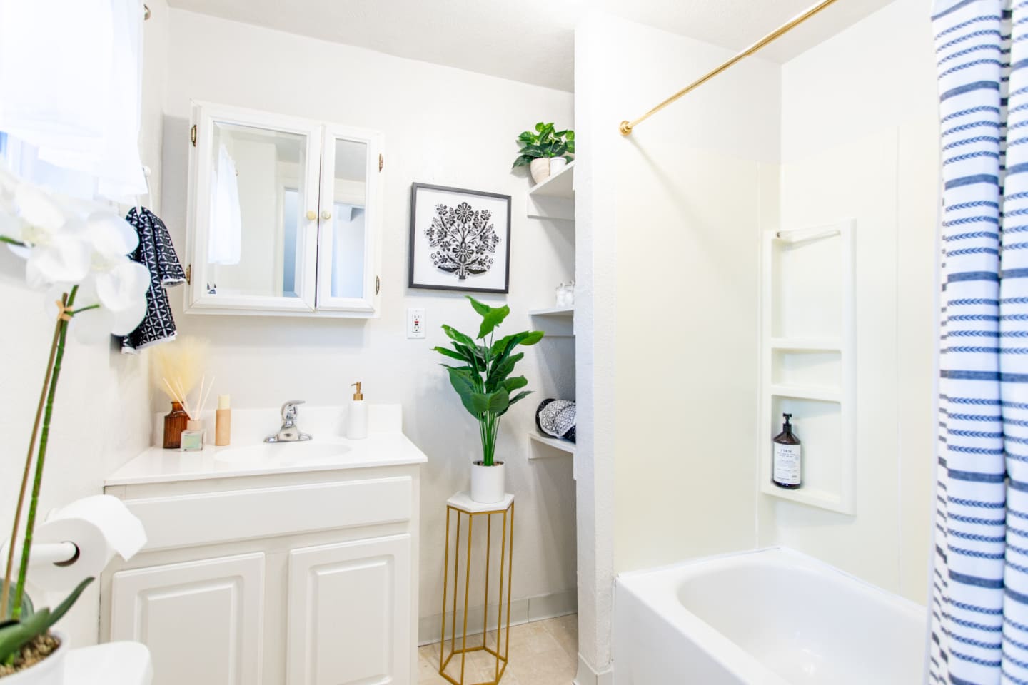 A full bathroom featuring a relaxing bathtub, along with essential fixtures like a sink and toilet, creating a complete and functional space for comfort and convenience.