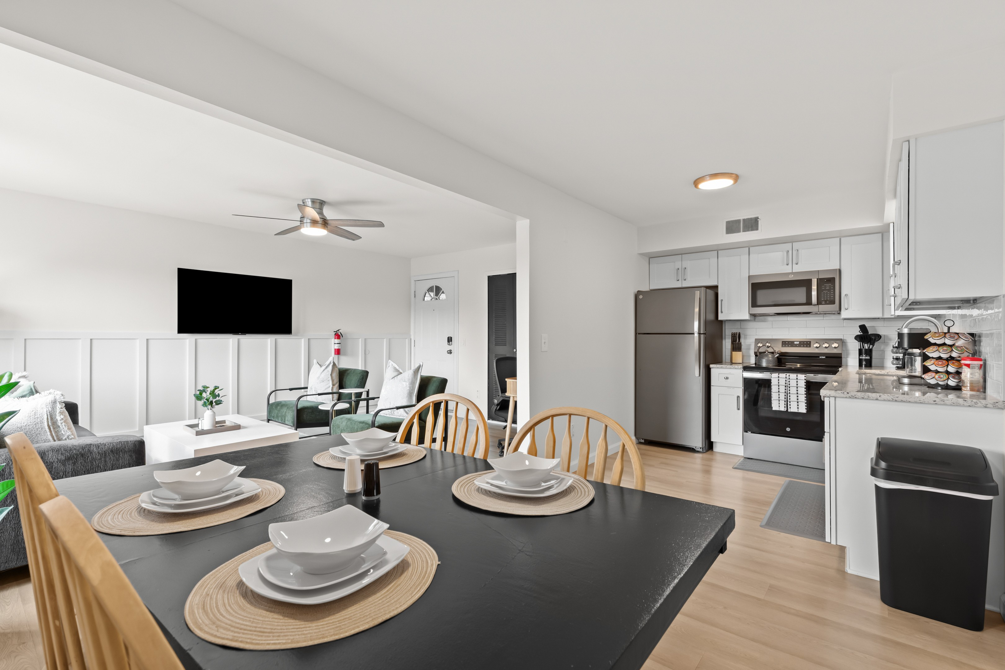View from the dining area into the living room and kitchen—open, bright, and welcoming.