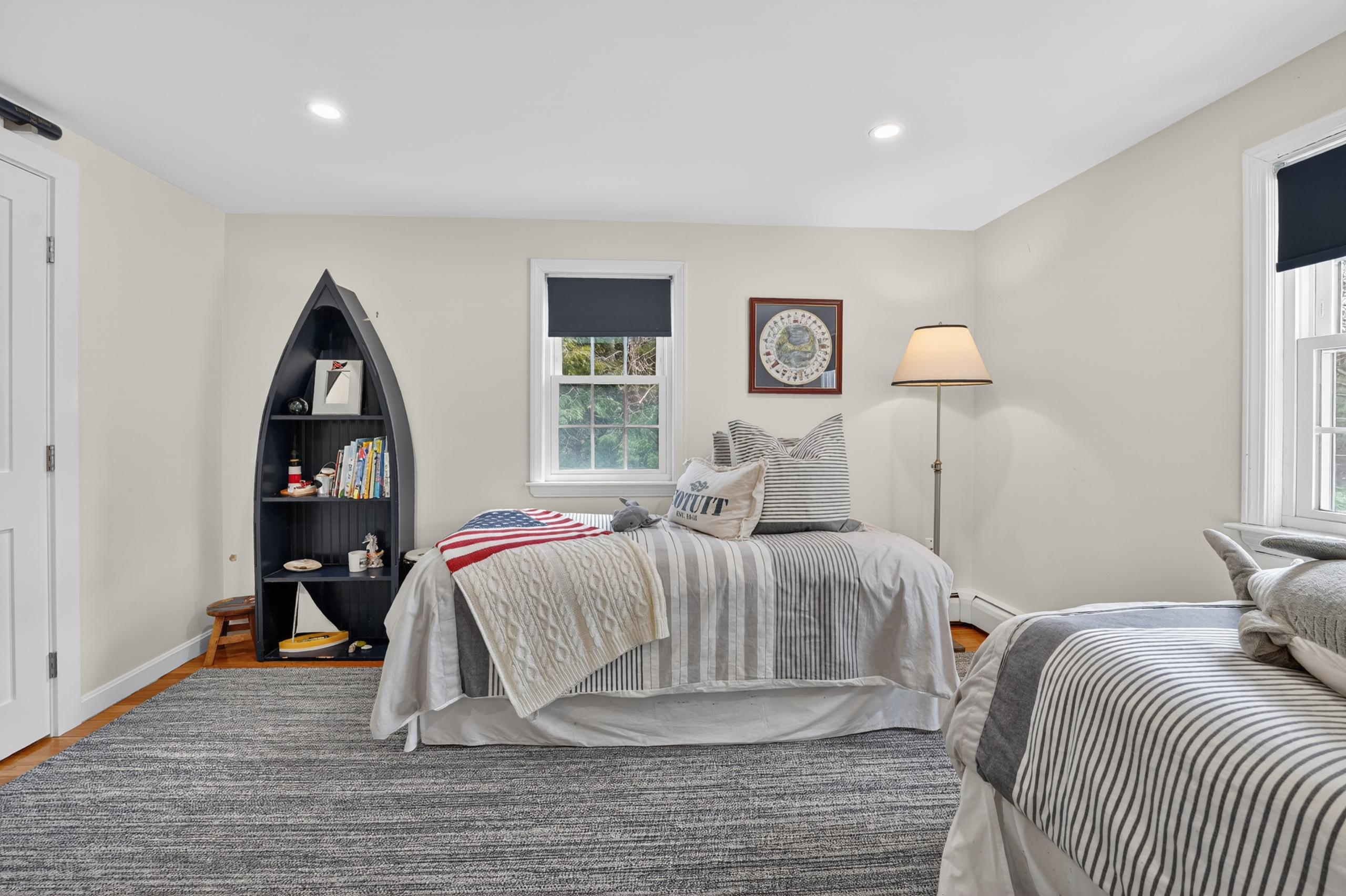 Unwind in the inviting fourth bedroom with two soft double beds for a good night’s rest!
