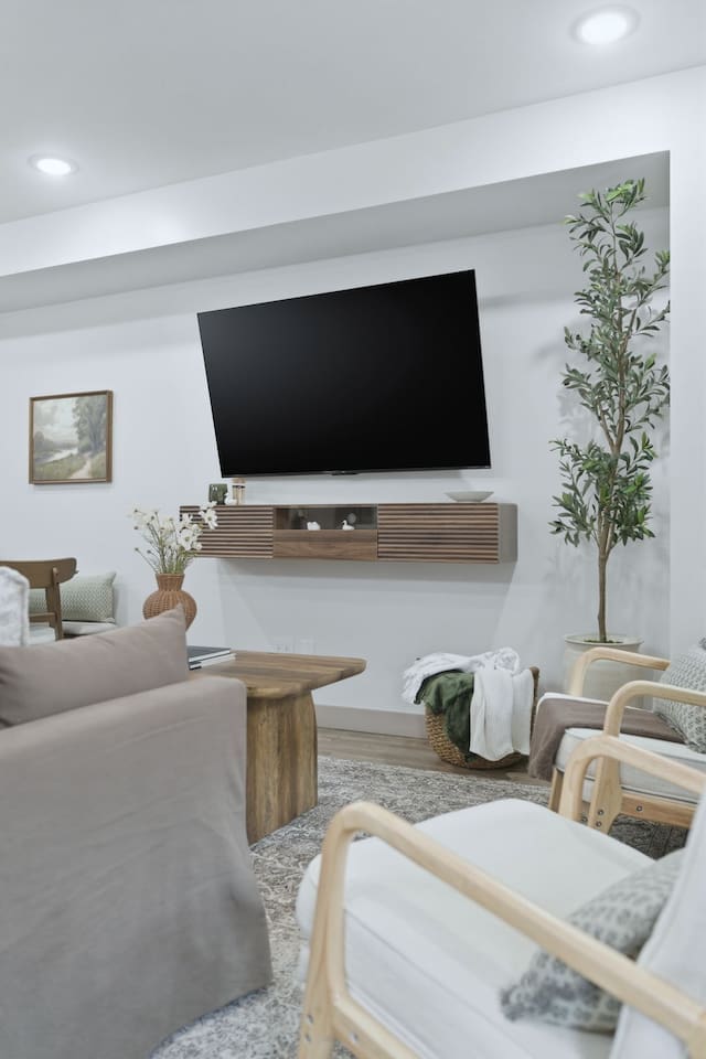 Relax and stream your favorite shows on the large wall-mounted TV from the comfort of the living room seating area.