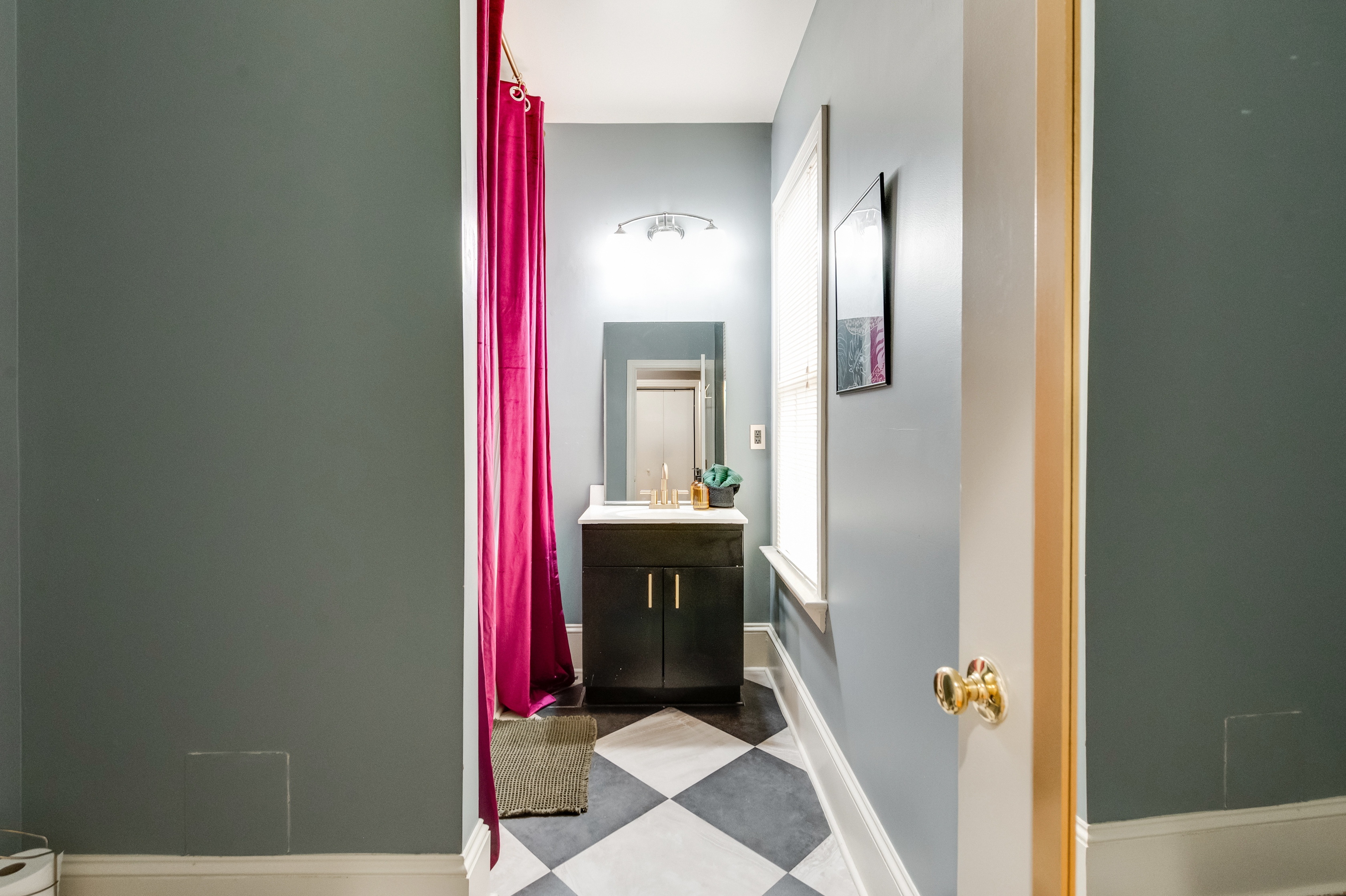 Ensuite to BR3: Modern fixtures and vibrant decor create a refreshing retreat for your stay!