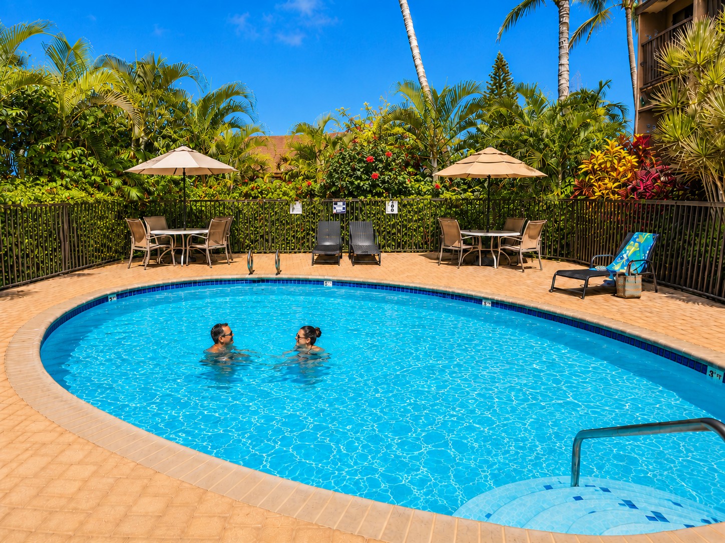 One of 3 swimming pools on property, one per building