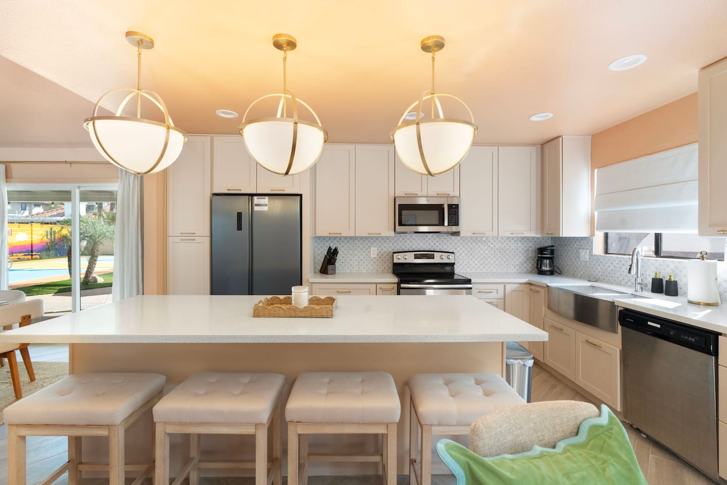 Stainless steel appliances and a farmhouse style sink in this well-equipped kitchen.