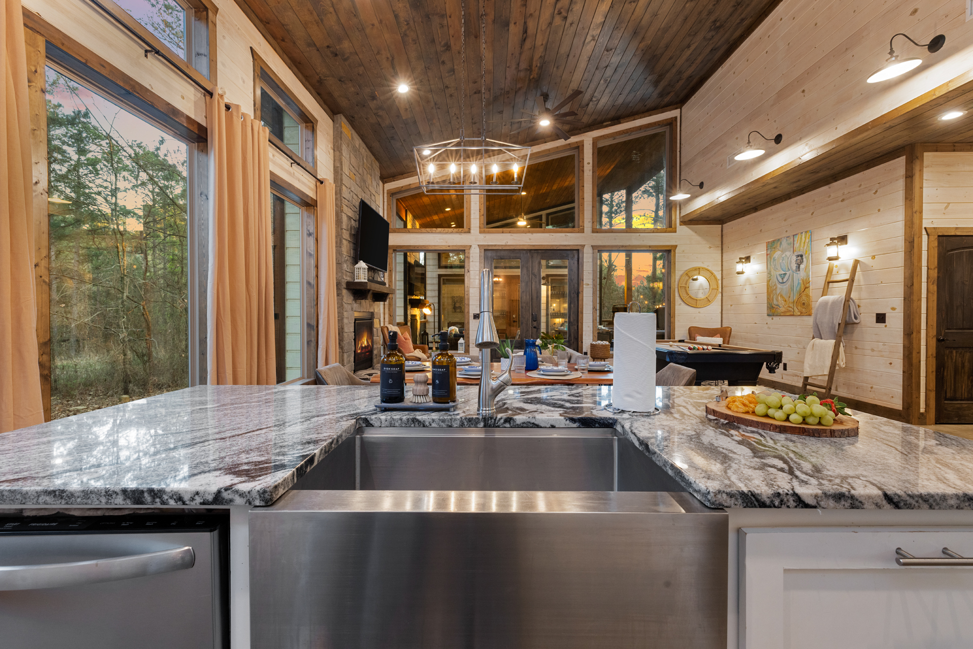 Sunlight dances across marble counters and warm wood tones, setting the scene for effortless meals and connection.