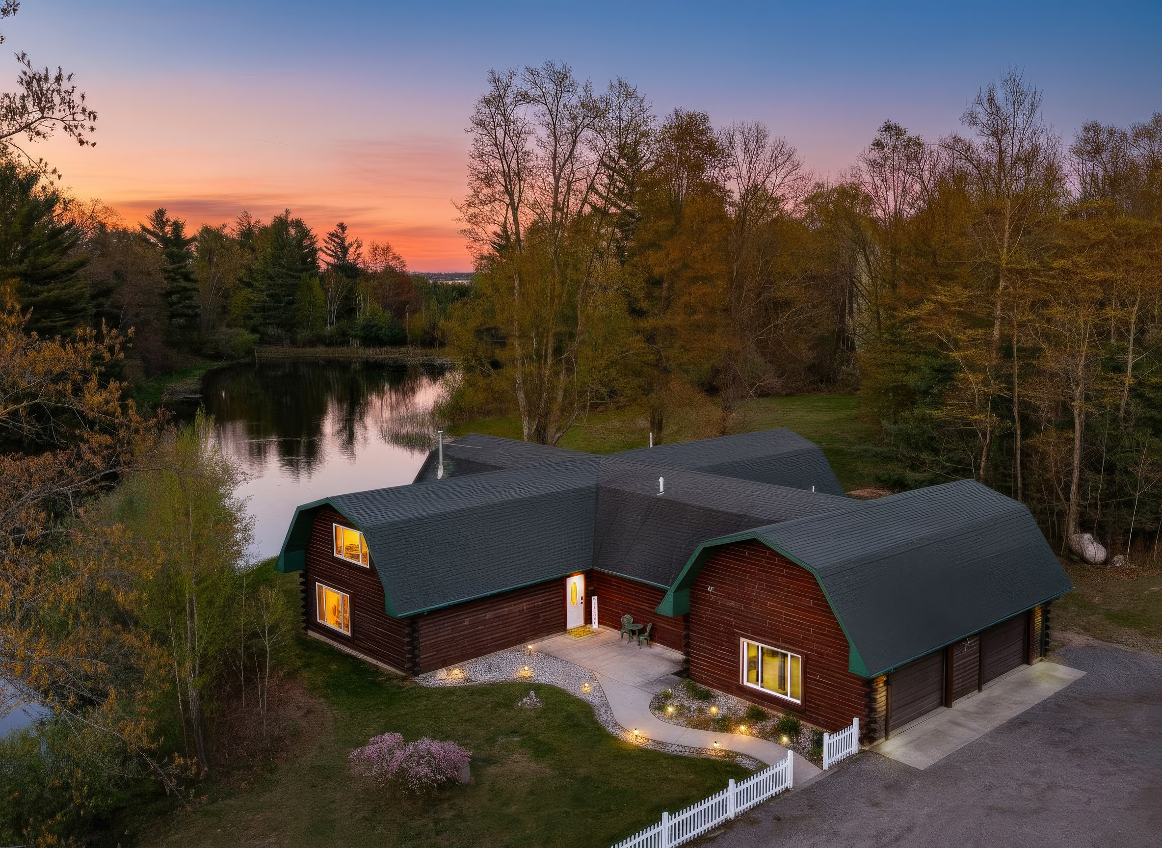 Aerial view of our home and pond.