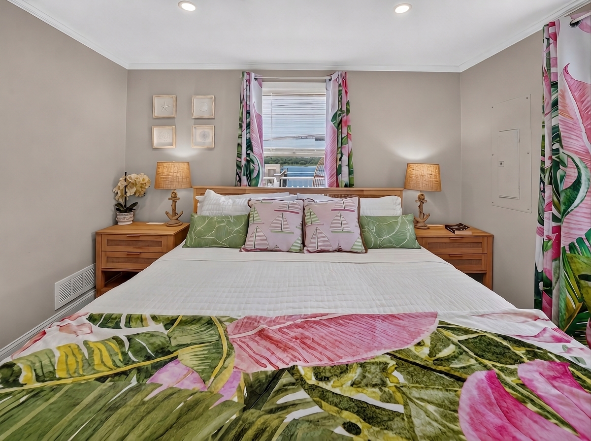 Stretch out and relax in a spacious bed surrounded by bright tropical accents.