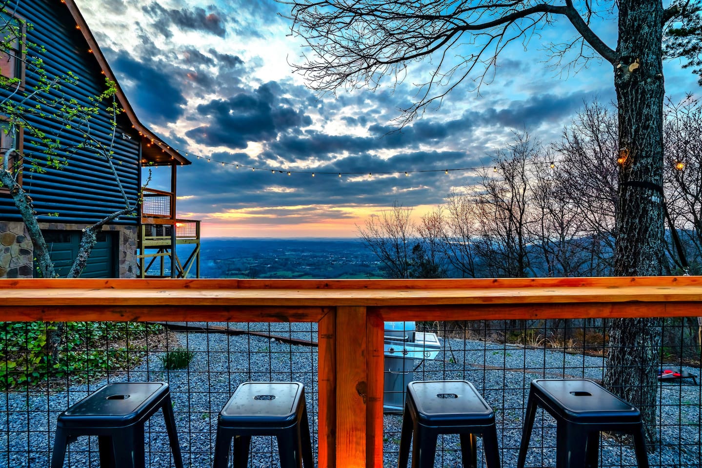 This is another bar table in the hangout deck area which offers cozy seating, panoramic mountain vistas, and colorful sunset, designed for relaxation and evening gatherings.”
